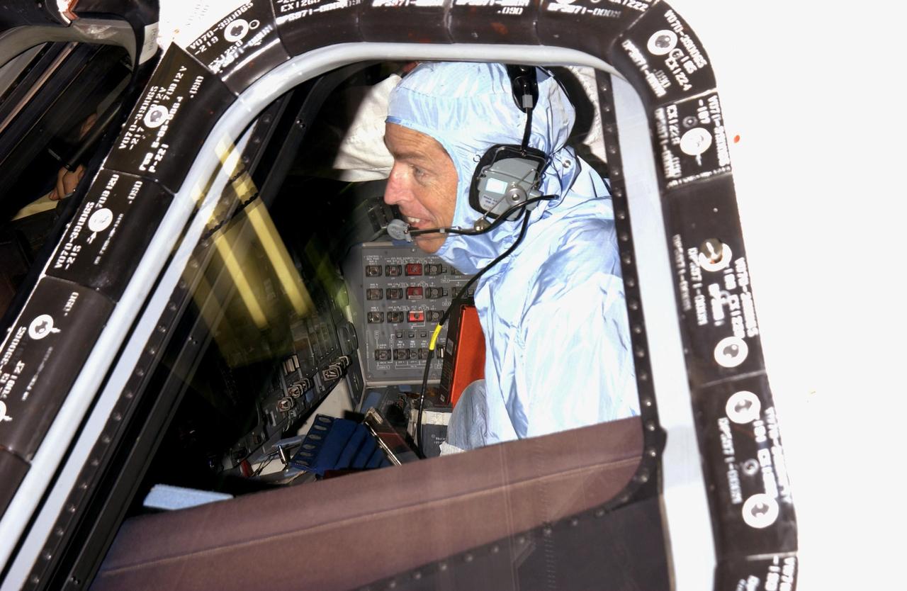KENNEDY SPACE CENTER, FLA. -- STS-113 Commander James Wetherbee checks the cockpit window from inside Endeavour. The check is part of Crew Equipment Interface Test activities, which include familiarization with equipment for the mission. The primary payloads on mission STS-113 are the first port truss segment, P1 Truss, to be attached to the central truss segment, S0, on the International Space Station, and the Crew and Equipment Translation Aid (CETA) Cart B that can be used by spacewalkers to move along the truss with equipment. Once delivered, the P1 truss will remain stowed until flight 12A.1. The mission will also deliver the Expedition 6 crew to the Station and return Expedition 5 to Earth. Space Shuttle Endeavour is scheduled to launch Nov. 10 on the 11-day mission.