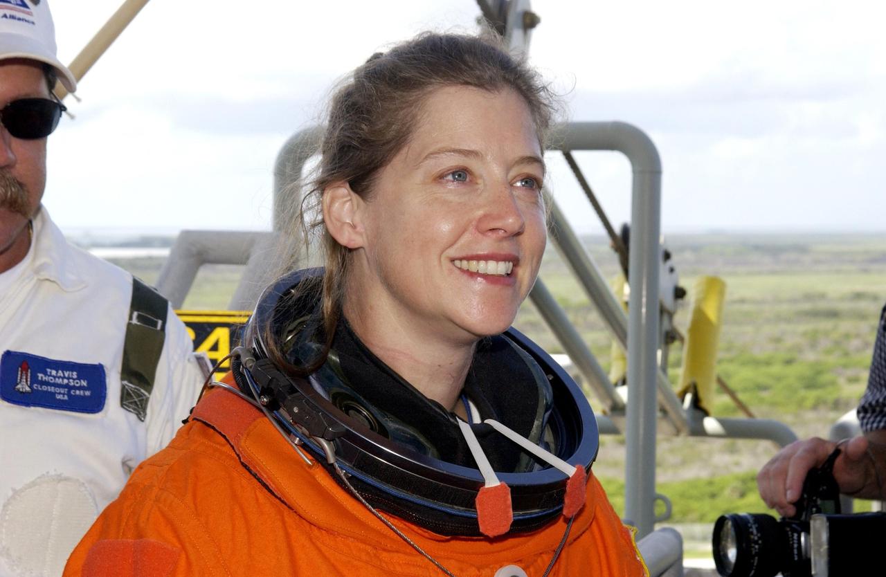 KENNEDY SPACE CENTER, FLA. - STS-112 Pilot Pamela Melroy takes a break during emergency egress practice on the 195-foot level of the Fixed Service Structure, Launch Pad 39B. She and the rest of the crew are taking part in Terminal Countdown Demonstration Test activities, which include a simulated launch countdown. Mission STS-112 aboard Space Shuttle Atlantis is scheduled to launch no earlier than Oct. 2, between 2 and 6 p.m. EDT.  STS-112 is the 15th assembly mission to the International Space Station.  Atlantis will be carrying the S1 Integrated Truss Structure, the first starboard truss segment, to be attached to the central truss segment, S0, and the Crew and Equipment Translation Aid (CETA) Cart A.  The CETA is the first of two human-powered carts that will ride along the ISS railway, providing mobile work platforms for future spacewalking astronauts.   