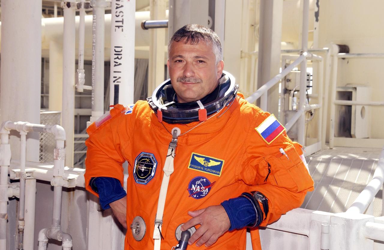 KENNEDY SPACE CENTER, FLA. - STS-112 Mission Specialist Fyodor Yurchikhin (with the Russian Space Agency) takes a break during emergency egress practice on the 195-foot level of the Fixed Service Structure, Launch Pad 39B. He and the rest of the crew are taking part in Terminal Countdown Demonstration Test activities, which include a simulated launch countdown. Mission STS-112 aboard Space Shuttle Atlantis is scheduled to launch no earlier than Oct. 2, between 2 and 6 p.m. EDT.  STS-112 is the 15th assembly mission to the International Space Station.  Atlantis will be carrying the S1 Integrated Truss Structure, the first starboard truss segment, to be attached to the central truss segment, S0, and the Crew and Equipment Translation Aid (CETA) Cart A.  The CETA is the first of two human-powered carts that will ride along the ISS railway, providing mobile work platforms for future spacewalking astronauts.  