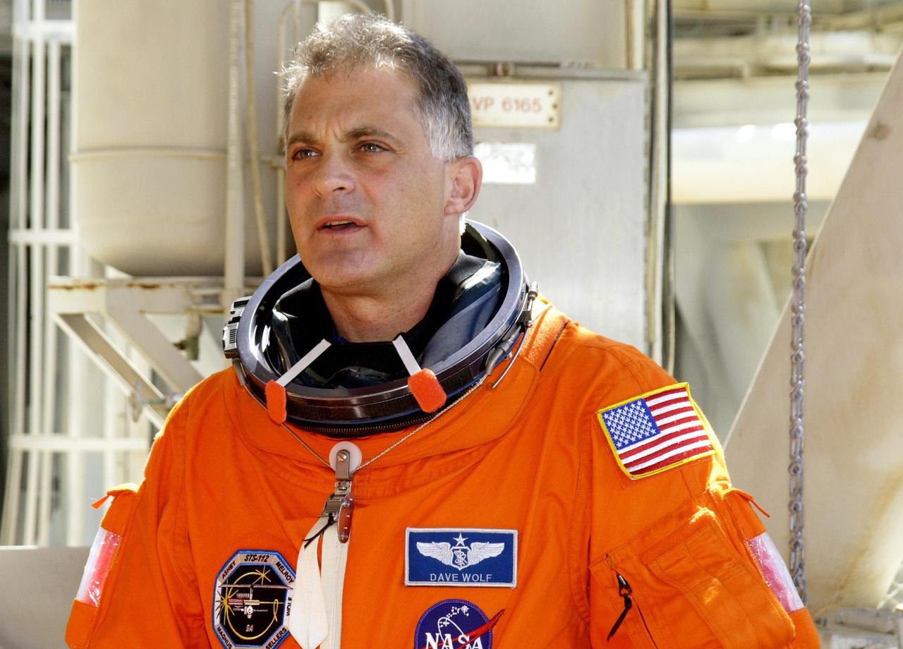 KENNEDY SPACE CENTER, FLA. -- STS-112 Mission Specialist David Wolf takes a break during emergency egress practice on the 195-foot level of the Fixed Service Structure, Launch Pad 39B. He and the rest of the crew are taking part in Terminal Countdown Demonstration Test activities, which include a simulated launch countdown. Mission STS-112 aboard Space Shuttle Atlantis is scheduled to launch no earlier than Oct. 2, between 2 and 6 p.m. EDT.  STS-112 is the 15th assembly mission to the International Space Station.  Atlantis will be carrying the S1 Integrated Truss Structure, the first starboard truss segment, to be attached to the central truss segment, S0, and the Crew and Equipment Translation Aid (CETA) Cart A.  The CETA is the first of two human-powered carts that will ride along the ISS railway, providing mobile work platforms for future spacewalking astronauts.      