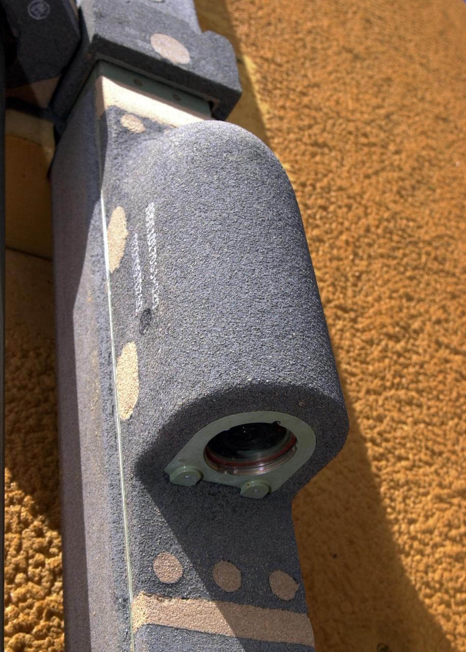 KENNEDY SPACE CENTER, FLA. - A closeup view of the camera mounted on the external tank of Space Shuttle Atlantis.  The color video camera mounted to the top of Atlantis' external tank will provide a view of the front and belly of the orbiter and a portion of the solid rocket boosters (SRBs) and external tank during the launch of Atlantis on mission STS-112.  It will offer the STS-112 team an opportunity to monitor the shuttle's performance from a new angle.  The camera will be turned on fifteen minutes prior to launch and will show the orbiter and solid rocket boosters on the launch pad. The video will be downlinked from the external   tank during flight to several NASA data-receiving sites and then relayed to the live television broadcast. The camera is expected to operate for about 15 minutes following liftoff. At liftoff, viewers will see the shuttle clearing the launch tower and, at two minutes after liftoff, see the right SRB separate from the external tank.   When the external tank separates from Atlantis about eight minutes into the flight, the camera is expected to continue its live feed for about six more minutes although NASA may be unable to pick up the camera's signal because the tank may have moved out of range.  