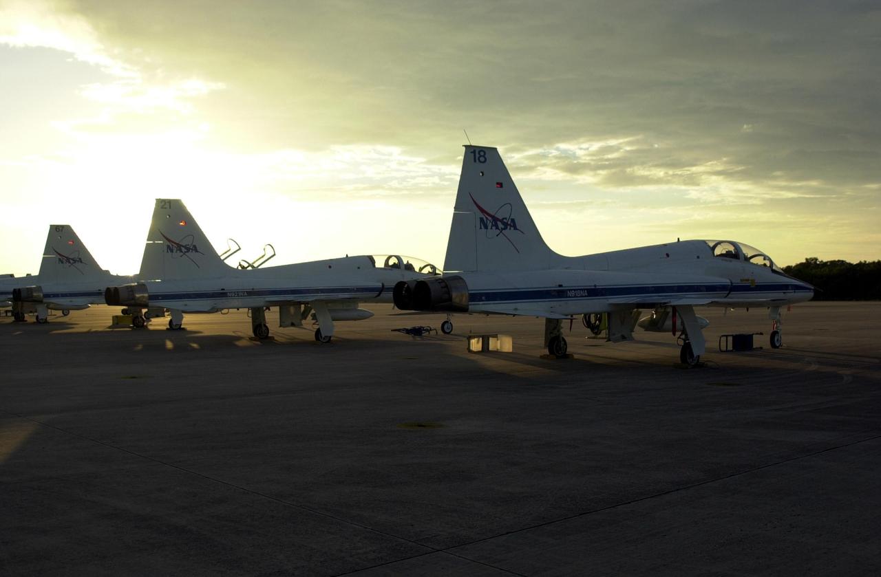 KENNEDY SPACE CENTER, FLA. -- At sunset after the arrival of the STS-112 crew, a row of T-38 jet aircraft are lined up on parking apron of the KSC Shuttle Landing Facility.  