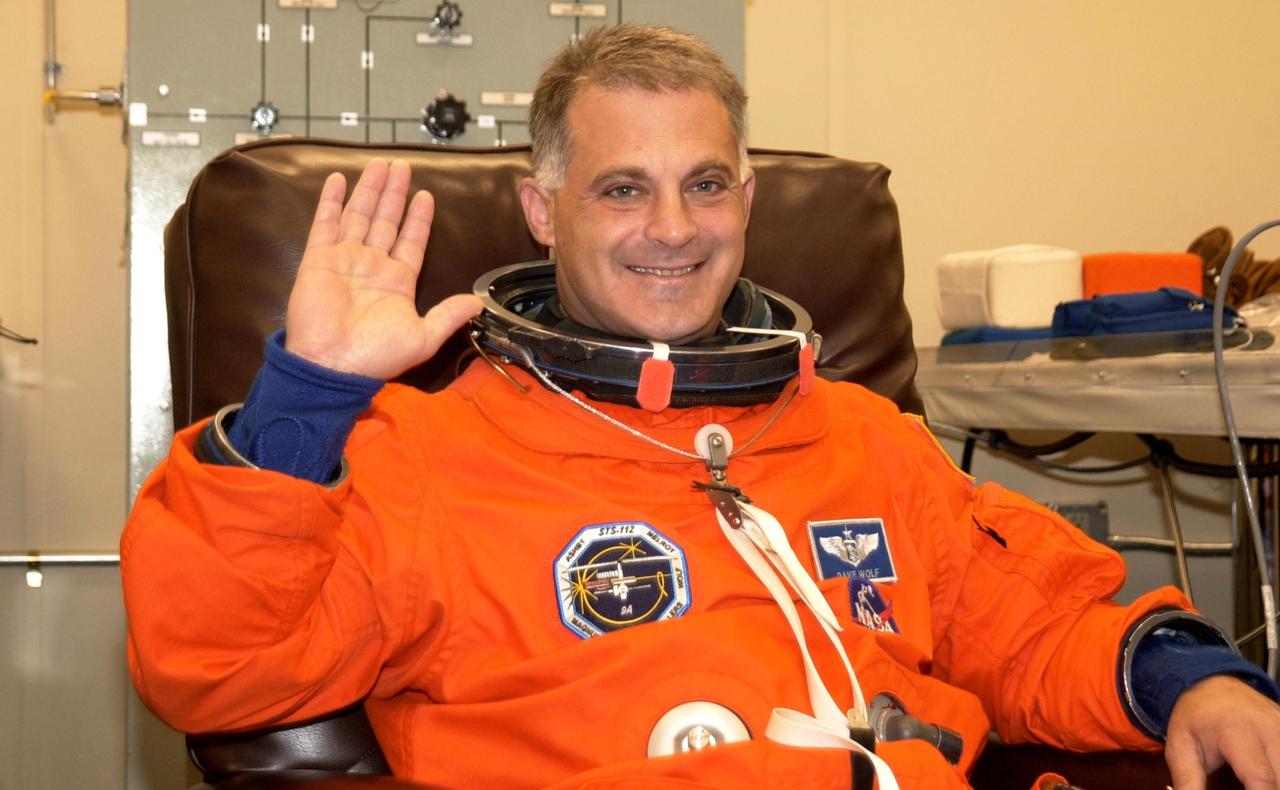 KENNEDY SPACE CENTER, FLA. --STS-112 Mission Specialist  David Wolf waves for the camera during a final fit check of his spacesuit in preparation for his launch to the International Space Station aboard Atlantis.  Launch is scheduled for Oct. 2 between 2 and 6 p.m. EDT.