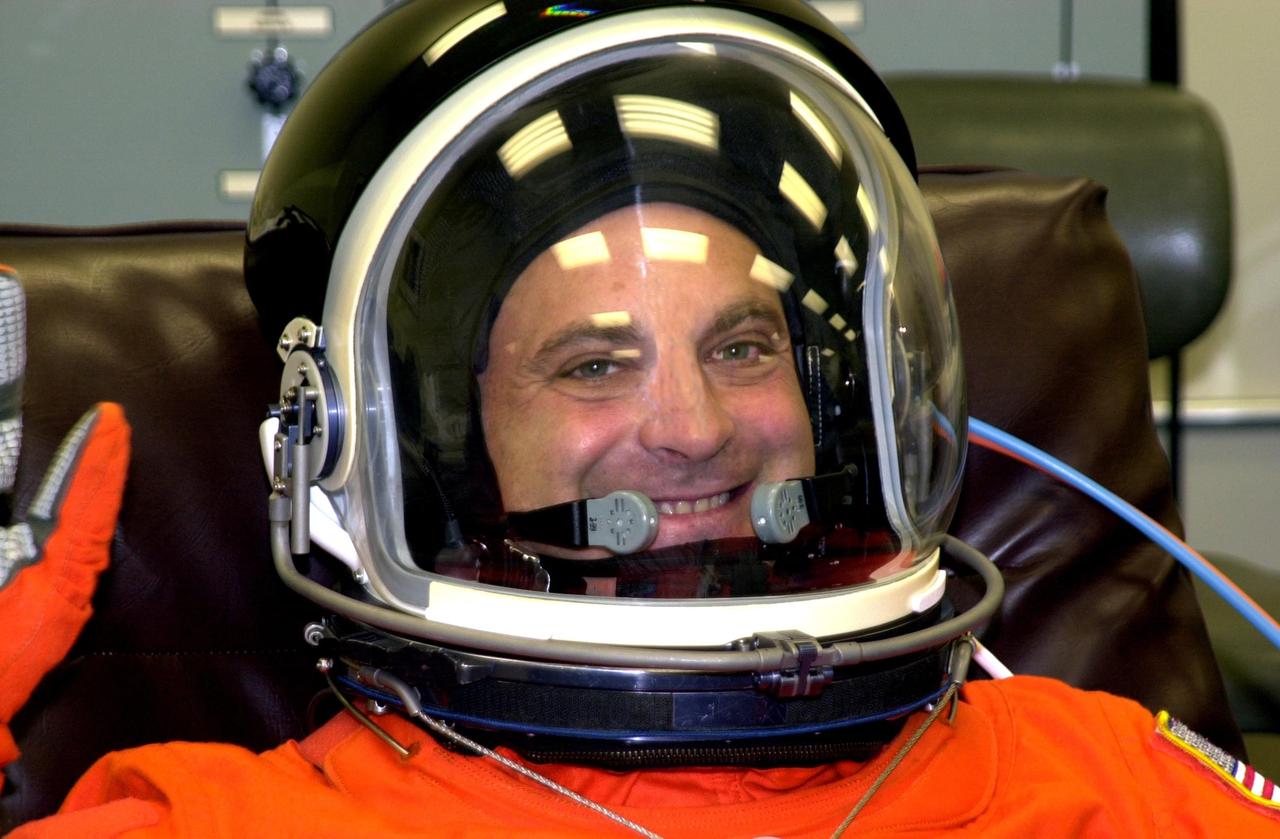 KENNEDY SPACE CENTER, FLA. --STS-112 Mission Specialist  David Wolf dons his spacesuit for a final fit check in preparation for his launch to the International Space Station aboard Atlantis.  Launch is scheduled for Oct. 2 between 2 and 6 p.m. EDT.