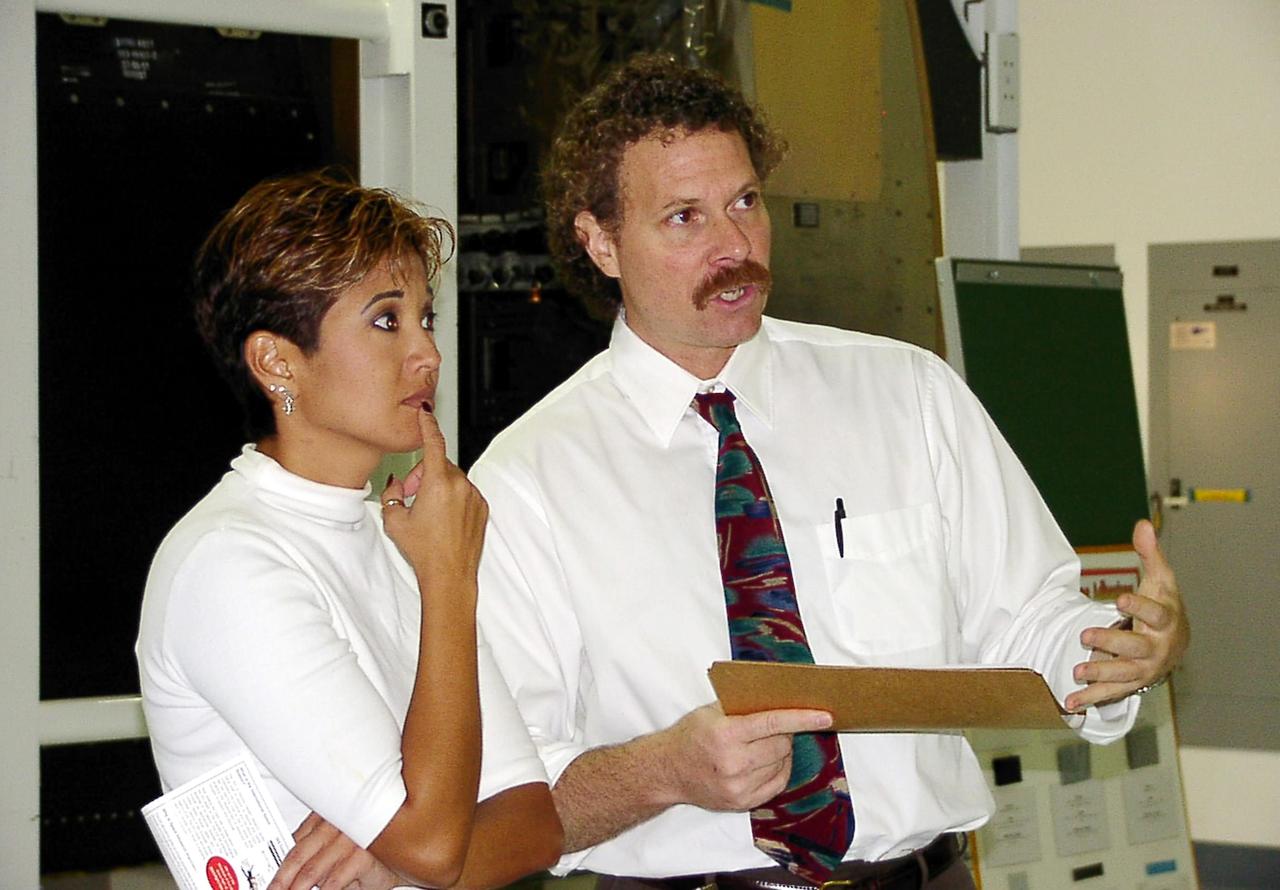 KENNEDY SPACE CENTER, FLA. -- WESH-TV 2 News Anchor Wendy Chioji (left) is given a tour of the Space Station Processing Facility by Russell Romanella, Deputy Director for Program Management in the International Space Staton / Payloads Processing Directorate. Chioji was at KSC to speak at the 2002 Combined Federal Campaign (CFC) kickoff rally.