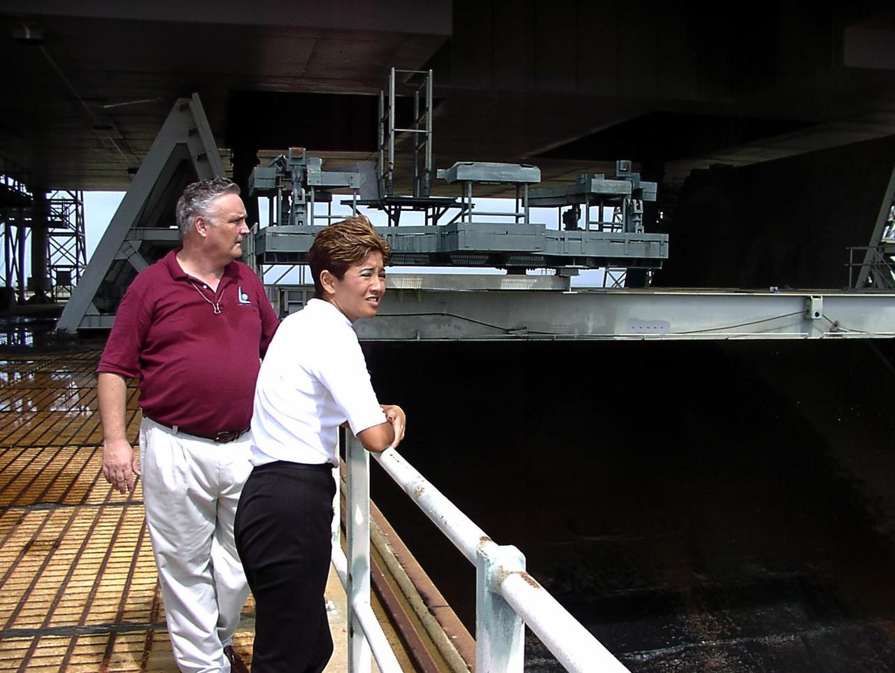 KENNEDY SPACE CENTER, FLA. -- WESH-TV 2 News Anchor Wendy Chioji (right) is given a tour of Launch Complex 39B by NASA's Stephen Bulloch. Chioji was at KSC to speak at the 2002 Combined Federal Campaign (CFC) kickoff rally.
