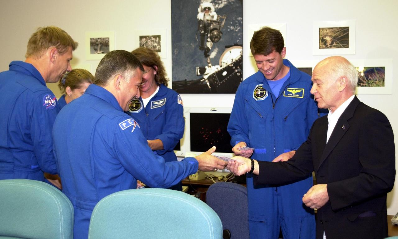 KENNEDY SPACE CENTER, FLA. - In the Operations and Checkout Building, Aslan Abashidze (right), President of the Autonomous Republic of Ajara in Georgia (Russia), visits with the STS-112 crew.  From left, they are Mission Specialist Piers J. Sellers; Pilot Pamela Ann Melroy; Mission Specialist Fyodor N. Yurchikhin, a cosmonaut with the Russian Space Agency; Mission Specialist Sandra H. Magnus; and CommanderJeffrey S. Ashby.  Mission Specialist David A. Wolf, not pictured, is also a member of the crew.  The crew is awaiting launch on mission STS-112 to the International Space Station aboard Space Shuttle Atlantis.  The launch has been postponed to no earlier than Monday, Oct. 7, so that the Mission Control Center, located at the Lyndon B. Johnson Space Center in Houston, Texas, can be secured and protected from potential storm impacts from Hurricane Lili.  