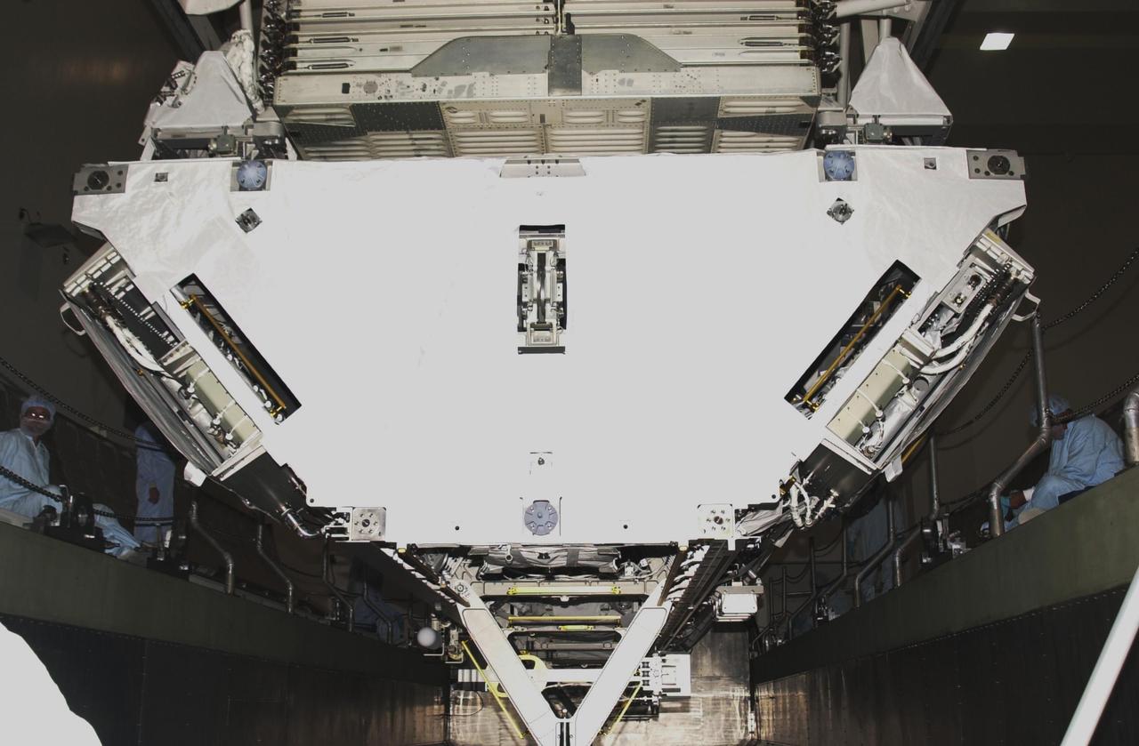 KENNEDY SPACE CENTER, FLA. -- Inside the Space Station Processing Facility, the P1 Truss Segment is lowered into the payload canister. The P1 truss is the primary payload for Mission STS-113. It is the first port truss segment which will be attached to the Station’s central truss segment, S0. Once delivered, the P1 truss will remain stowed until flight 12A.1. The mission will also deliver the Expedition 6 crew to the Station and return Expedition 5 to Earth. Space Shuttle Endeavour is scheduled to launch no earlier than Nov. 10 on the 11-day mission.