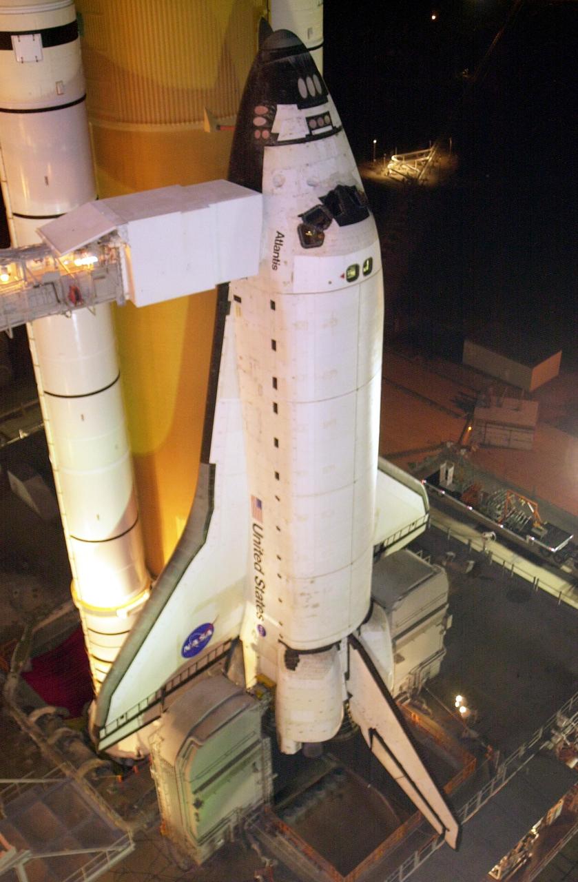 KENNEDY SPACE CENTER, FLA. -- After rollback of the Rotating Service Structure, Space Shuttle Atlantis is revealed on pad 39B prior to launch. The orbiter access arm with the White Room at the end can be seen extending toward the cockpit. The White Room provides entry into the Shuttle for the crew. The Shuttle is scheduled for launch Oct. 7 at 3:46 p.m. EDT on mission STS-112.