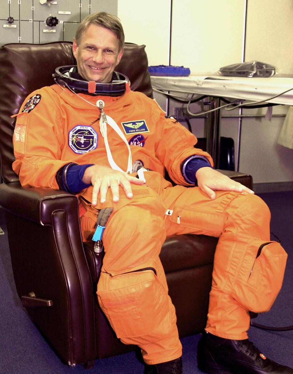 KENNEDY SPACE CENTER, FLA. - During suitup for launch, STS-112 Mission Specialist Piers Sellers smiles in anticipation of his first Shuttle flight. STS-112 is the 15th assembly flight to the International Space Station, carrying the S1 Integrated Truss Structure and the Crew and Equipment Translation Aid (CETA) Cart A. The CETA is the first of two human-powered carts that will ride along the ISS railway, providing mobile work platforms for future spacewalking astronauts. On the 11-day mission, three spacewalks are planned to attach the S1 truss to the Station. Launch is scheduled for 3:46 p.m. EDT from Launch Pad 39B.