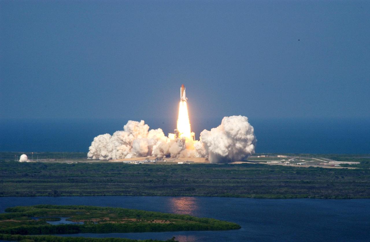 KENNEDY SPACE CENTER, FLA. -- Space Shuttle Atlantis roars into the clear blue sky from the billows of smoke below after launch on mission STS-112, the 15th assembly flight to the International Space Station. Liftoff from Launch Pad 39B occurred at 3:46 p.m. EDT. Atlantis carries the S1 Integrated Truss Structure and the Crew and Equipment Translation Aid (CETA) Cart A. The CETA is the first of two human-powered carts that will ride along the ISS railway, providing mobile work platforms for future spacewalking astronauts. On the 11-day mission, three spacewalks are planned to attach the S1 truss. providing mobile work platforms for future spacewalking astronauts. On the 11-day mission, three spacewalks are planned to attach the S1 truss to the Station.