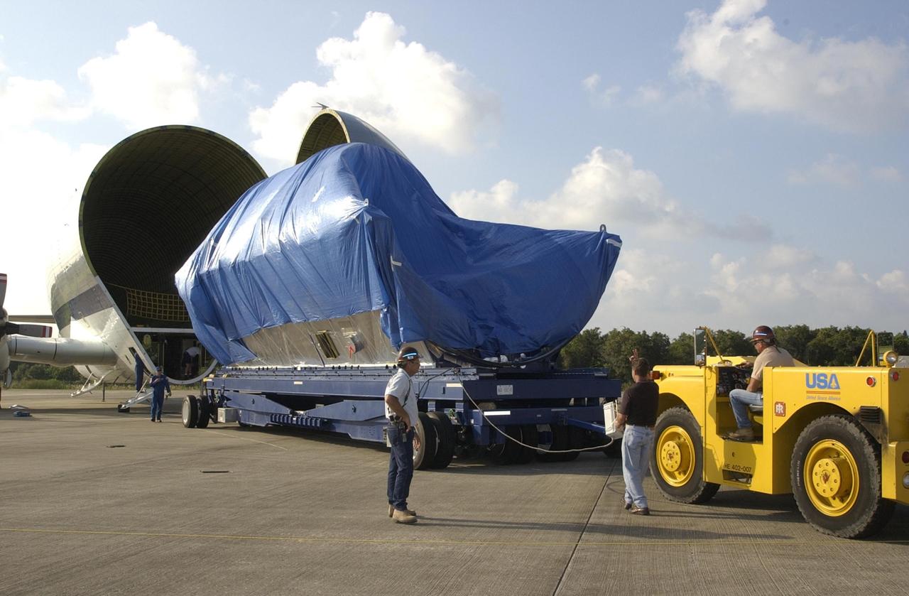 KENNEDY SPACE CENTER, FLA. -- The node structural test article (STA) is offloaded through the open nose of the Super Guppy transport aircraft following its arrival at Kennedy Space Center from Marshall Space Flight Center in Huntsville, Ala. It was moved to KSC for storage. An exact replica of the Unity Node on the International Space Station, the node STA was used at MSFC for testing and validation purposes. The Unity Node is the pressurized element that connects the other ISS pressurized modules together and was the first U.S. element to launch.