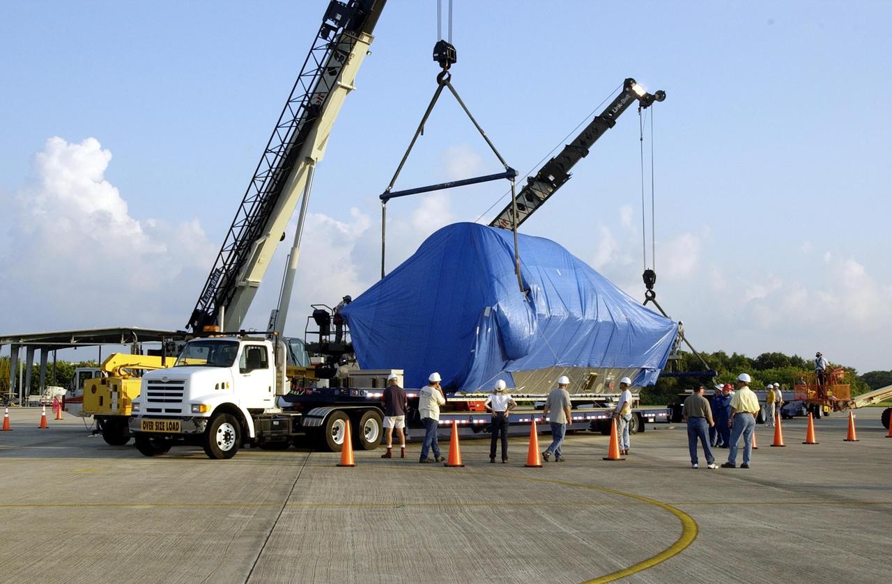 KENNEDY SPACE CENTER, FLA. -- Following its arrival at Kennedy Space Center, The node structural test article (STA) begins its move to a storage facility. The super Guppy transport aircraft carried Node STA to KSC's Shuttle Landing Facility from Marshall Space Flight Center in Huntsville, Ala. An exact replica of the Unity Node on the International Space Station, the node STA was used at MSFC for testing and validation purposes. The Unity Node is the pressurized element that connects the other ISS pressurized modules together and was the first U.S. element to launch.