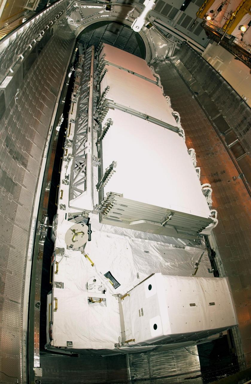 KENNEDY SPACE CENTER, FLA. -- At Launch Complex 39A, the payload canister doors are open to reveal the P1 truss before transfer to the Payload Changeout Room. The P1 truss is the primary payload for Mission STS-113 to the International Space Station. It is the first port truss segment which will be attached to the Station’s central truss segment, S0. Once delivered, the P1 truss will remain stowed until flight 12A.1. The mission will also deliver the Expedition 6 crew to the Station and return Expedition 5 to Earth. Space Shuttle Endeavour is scheduled to launch no earlier than Nov. 10 on the 11-day mission.