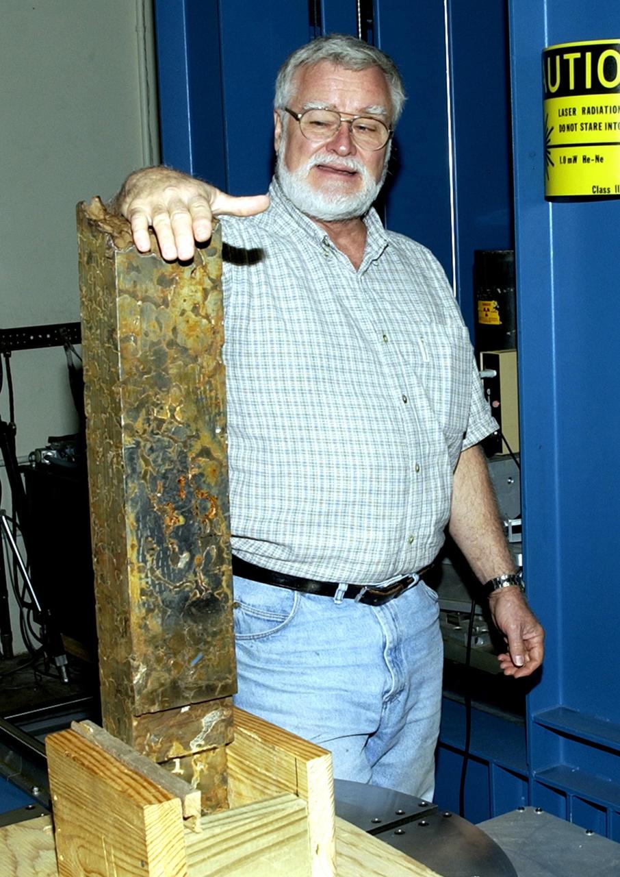 KENNEDY SPACE CENTER, FLA.  -- Pete Engel, an engineering specialist in Wyle Laboratory's Nondestructive Testing Laboratory at KSC, explains the testing being performed on a 100-pound Mundrabilla meteorite sample.  The one-of-a-kind meteorite was found 36 years ago in Australia and is on loan to Marshall Space Flight Center (MSFC) from the Smithsonian Institution's National Museum of Natural History.  Dr. Donald Gillies, discipline scientist for materials science at MSFC's Microgravity Science and Applications Department, is the Principal Investigator.  The studies may help provide the science community and industry with fundamental knowledge for use in the design of advanced materials.