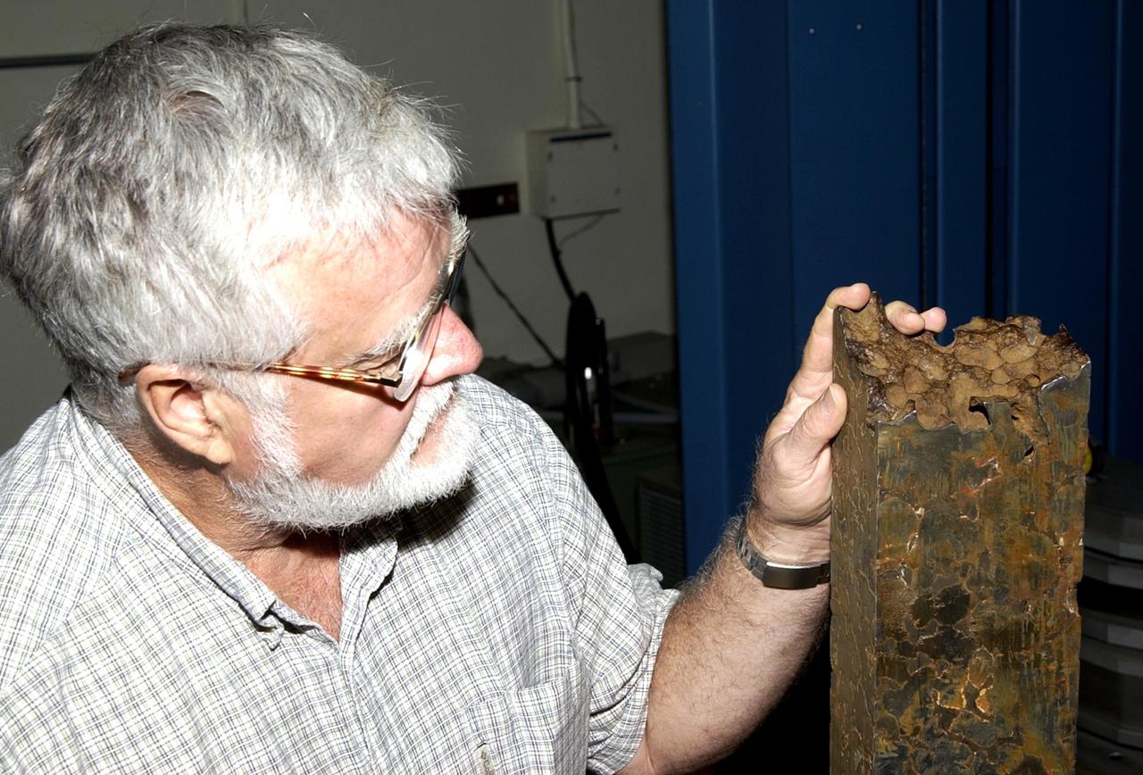 KENNEDY SPACE CENTER, FLA.  -- Pete Engel, an engineering specialist in Wyle Laboratory's Nondestructive Testing Laboratory at KSC, explains the testing being performed on a 100-pound Mundrabilla meteorite sample.  The one-of-a-kind meteorite was found 36 years ago in Australia and is on loan to Marshall Space Flight Center (MSFC) from the Smithsonian Institution's National Museum of Natural History.  Dr. Donald Gillies, discipline scientist for materials science at MSFC's Microgravity Science and Applications Department, is the Principal Investigator.  The studies may help provide the science community and industry with fundamental knowledge for use in the design of advanced materials.