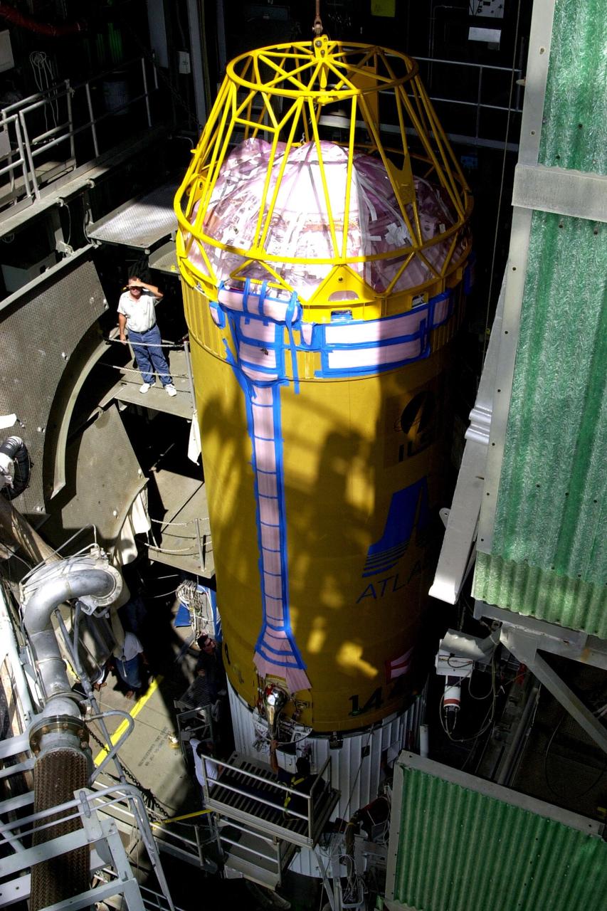 KENNEDY SPACE CENTER, FLA. -- At Launch Complex 36-A, Cape Canaveral Air Force Station, a Lockheed Martin Atlas Centaur IIA (AC-144) rocket arrives at the top of the launch tower. The rocket will be used in the launch of TDRS-J, scheduled for  Nov. 20.  The third in a series of telemetry satellites, TDRS-J will help replenish the current constellation of geosynchronous TDRS satellites. The TDRS System is the primary source of space-to-ground voice, data and telemetry for the Space Shuttle. It also provides communications with the International Space Station and scientific spacecraft in low-Earth orbit such as the Hubble Space Telescope. This new advanced series of satellites will extend the availability of TDRS communications services until about 2017.