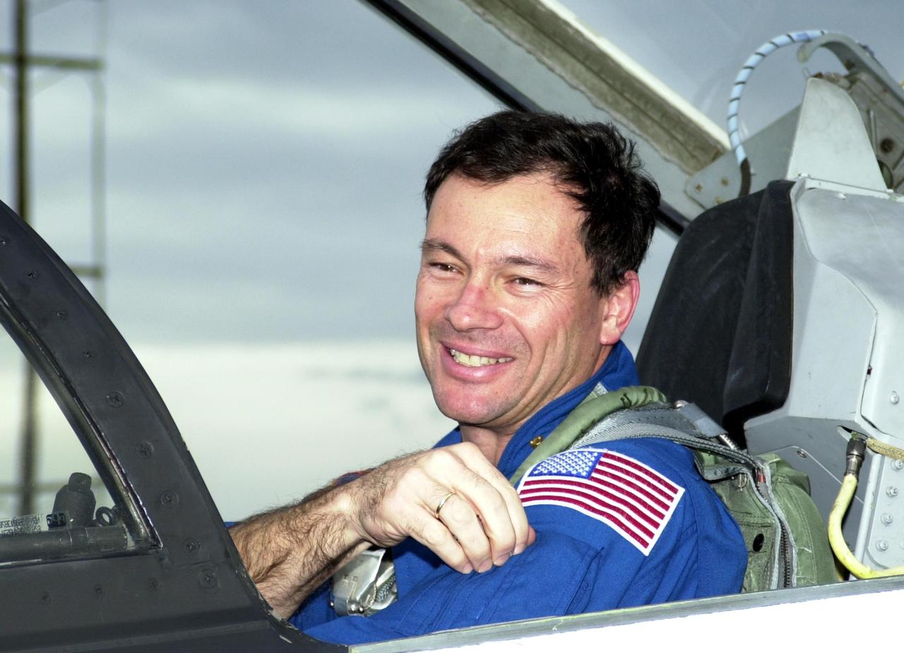 KENNEDY SPACE CENTER, FLA. --  STS-113 Mission Specialist Michael Lopez-Alegria arrives at KSC for Terminal Countdown Demonstration Test activities, which include a simulated launch countdown. The primary payloads on mission STS-113 are the first port truss segment, P1, and the Crew and Equipment Translation Aid (CETA) Cart B.   Once delivered, the P1 truss will remain stowed until flight 12A.1 in 2003 when it will be attached to the central truss segment, S0, on the Space Station.  Also onboard Space Shuttle Endeavour will be the Expedition 6 crew who will replace Expedition 5, returning to Earth after 4 months.  The STS-113 launch is scheduled for Nov. 10, 2002.  