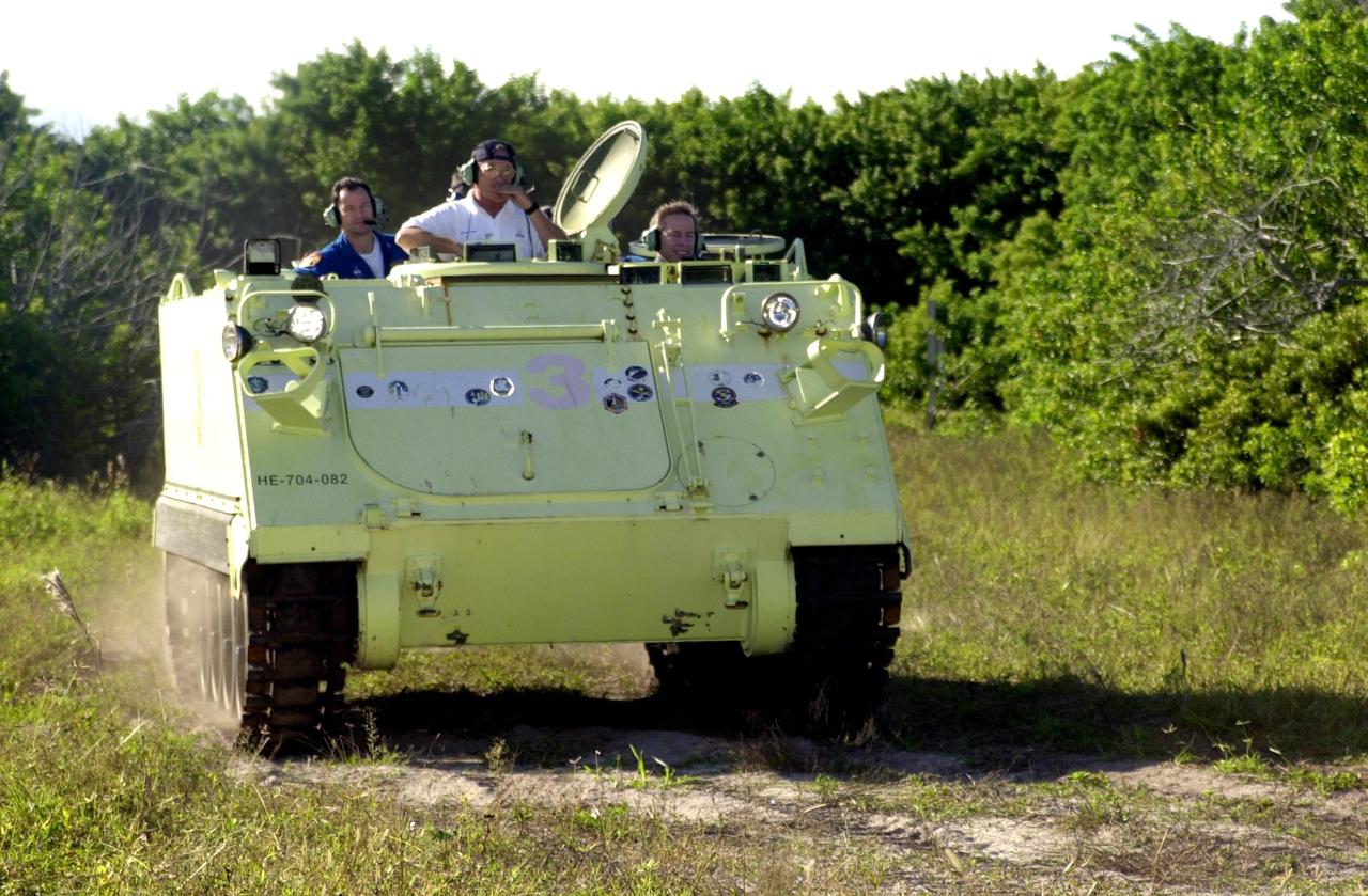 KENNEDY SPACE CENTER, FLA. -- STS-113 Mission Commander James Wetherbee practices driving an M-113 armored personnel carrier, part of emergency egress training during Terminal Countdown Demonstration Test activities. He and the rest of the crew are preparing for the mission aboard Space Shuttle Endeavour, which is scheduled to launch Nov. 10. The TCDT includes a launch countdown. The primary payloads on mission STS-113 are the first port truss segment, P1, and the Crew and Equipment Translation Aid (CETA) Cart B. Once delivered, the P1 truss will remain stowed until flight 12A.1 in 2003 when it will be attached to the central truss segment, S0, on the Space Station. Also onboard Space Shuttle Endeavour will be the Expedition 6 crew who will replace Expedition 5, returning to Earth after 4 months.