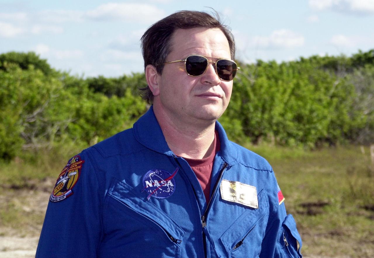 KENNEDY SPACE CENTER, FLA. -- Expedition 6 crew member Nikolai Budarin stands ready for a practice drive in an M-113 armored personnel carrier during emergency egress training at the pad, one of the Terminal Countdown Demonstration Test activities in preparation for launch. The TCDT also includes a simulated launch countdown. The Expedition 6 crew will travel on Space Shuttle Endeavour to the International Space Station to replace Expedition 5, returning to Earth after 4 months. The primary payloads on mission STS-113 are the first port truss segment, P1, and the Crew and Equipment Translation Aid (CETA) Cart B. Once delivered, the P1 truss will remain stowed until flight 12A.1 in 2003 when it will be attached to the central truss segment, S0, on the Space Station. Launch is scheduled for Nov. 10, 2002.