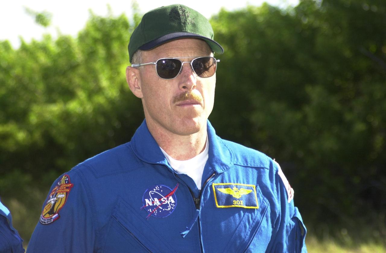 KENNEDY SPACE CENTER, FLA. -- Expedition 6 Commander Ken Bowersox stands ready for a practice drive in an M-113 armored personnel carrier during emergency egress training at the pad, one of the Terminal Countdown Demonstration Test activities in preparation for launch. The TCDT also includes a simulated launch countdown. The Expedition 6 crew will travel on Space Shuttle Endeavour to the International Space Station to replace Expedition 5, returning to Earth after 4 months. The primary payloads on mission STS-113 are the first port truss segment, P1, and the Crew and Equipment Translation Aid (CETA) Cart B. Once delivered, the P1 truss will remain stowed until flight 12A.1 in 2003 when it will be attached to the central truss segment, S0, on the Space Station. Launch is scheduled for Nov. 10, 2002.