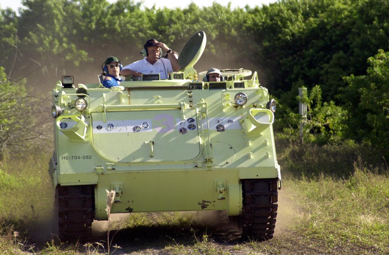 KENNEDY SPACE CENTER, FLA. -- Expedition 6 crew member Donald Pettit concentrates on driving an M-113 armored personnel carrier during emergency egress training at the pad. The crew is preparing for the mission aboard Space Shuttle Endeavour, which is scheduled to launch Nov. 10, by taking part in Terminal Countdown Demonstration Test activities. The TCDT includes a simulated launch countdown.. The Expedition 6 crew will travel on Space Shuttle Endeavour to the International Space Station to replace Expedition 5, returning to Earth after 4 months. The primary payloads on mission STS-113 are the first port truss segment, P1, and the Crew and Equipment Translation Aid (CETA) Cart B. Once delivered, the P1 truss will remain stowed until flight 12A.1 in 2003 when it will be attached to the central truss segment, S0, on the Space Station. Launch is scheduled for Nov. 10, 2002.