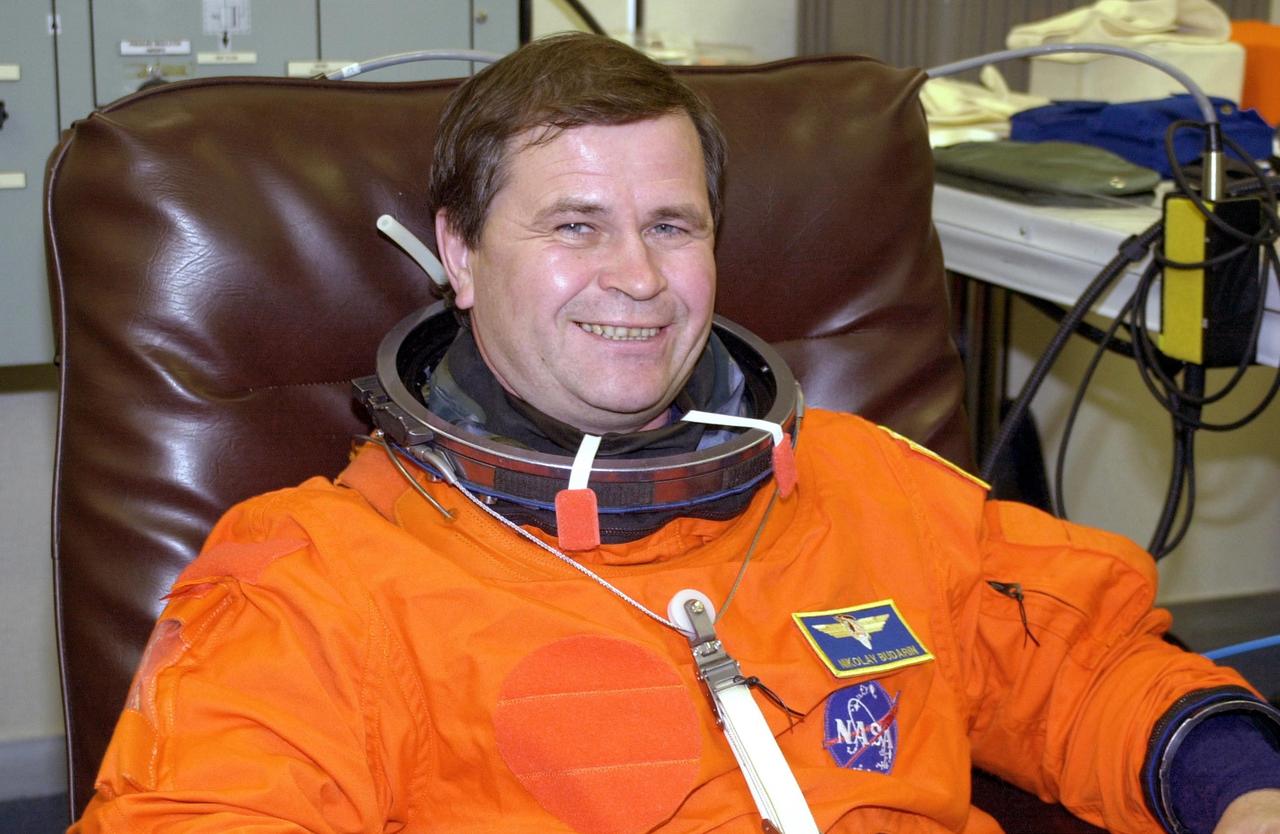 KENNEDY SPACE CENTER, FLA. -- Expedition 6 crew member Nikolai Budarin relaxes during fit check of his launch and entry suit, part of Terminal Countdown Demonstration Test activities. He and the rest of the crew are preparing for the mission aboard Space Shuttle Endeavour, which is scheduled to launch Nov. 10. The TCDT includes emergency egress training and a launch countdown. The Expedition 6 crew will travel on Space Shuttle Endeavour to the International Space Station to replace Expedition 5, returning to Earth after 4 months. The primary payloads on mission STS-113 are the first port truss segment, P1, and the Crew and Equipment Translation Aid (CETA) Cart B. Once delivered, the P1 truss will remain stowed until flight 12A.1 in 2003 when it will be attached to the central truss segment, S0, on the Space Station. Launch is scheduled for Nov. 10, 2002.