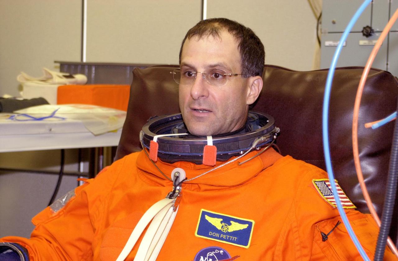 KENNEDY SPACE CENTER, FLA. -- STS-113 Mission Specialist Donald Pettit relaxes during fit check of his launch and entry suit, part of Terminal Countdown Demonstration Test activities. He and the rest of the crew are preparing for the mission aboard Space Shuttle Endeavour, which is scheduled to launch Nov. 10. The TCDT includes emergency egress training and a launch countdown. The primary payloads on mission STS-113 are the first port truss segment, P1, and the Crew and Equipment Translation Aid (CETA) Cart B. Once delivered, the P1 truss will remain stowed until flight 12A.1 in 2003 when it will be attached to the central truss segment, S0, on the Space Station. Also onboard Space Shuttle Endeavour will be the Expedition 6 crew who will replace Expedition 5, returning to Earth after 4 months.