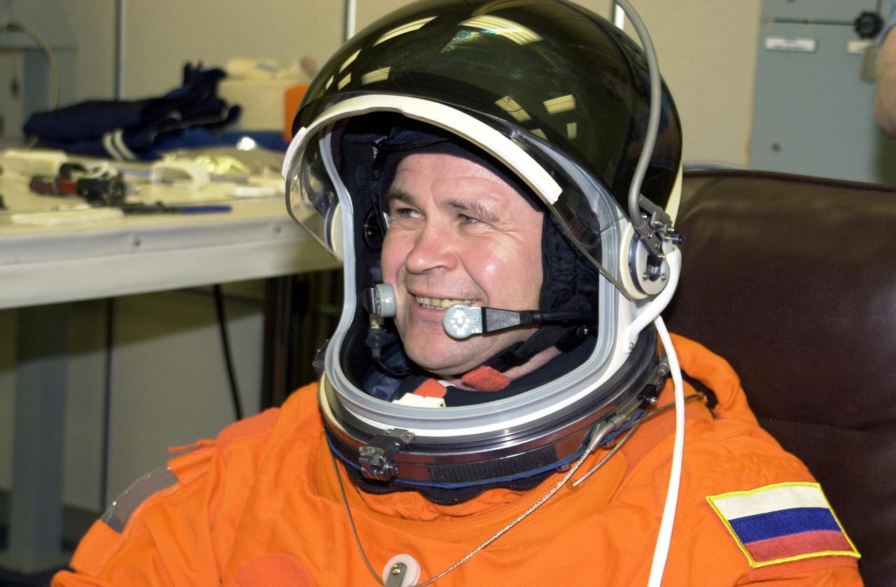 KENNEDY SPACE CENTER, FLA. -- Expedition 6 crew member Nikolai Budarin smiles during fit check of his helmet, part of Terminal Countdown Demonstration Test activities. He and the rest of the crew are preparing for the mission aboard Space Shuttle Endeavour, which is scheduled to launch Nov. 10. The TCDT includes emergency egress training and a launch countdown. The Expedition 6 crew will travel on Space Shuttle Endeavour to the International Space Station to replace Expedition 5, returning to Earth after 4 months. The primary payloads on mission STS-113 are the first port truss segment, P1, and the Crew and Equipment Translation Aid (CETA) Cart B. Once delivered, the P1 truss will remain stowed until flight 12A.1 in 2003 when it will be attached to the central truss segment, S0, on the Space Station. Launch is scheduled for Nov. 10, 2002.