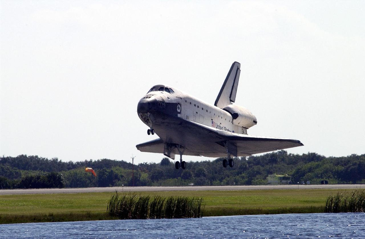 KENNEDY SPACE CENTER, FLA. -   Space Shuttle Atlantis approaches the runway at the Shuttle Landing Facility, completing the 4.5-million-mile journey to the International Space Station.  Main gear touchdown occurred at 11:43:40 a.m. EDT; nose gear touchdown at 11:43:48 a.m.; and wheel stop at 11:44:35 a.m.  Mission elapsed time was 10:19:58:44.  Mission STS-112 expanded the size of the Station with the addition of the S1 truss segment.  The returning crew of Atlantis are Commander Jeffrey Ashby, Pilot Pamela Melroy, and Mission Specialists David Wolf, Piers Sellers, Sandra Magnus and Fyodor Yurchikhin. This landing is the 60th at KSC in the history of the Shuttle program.  