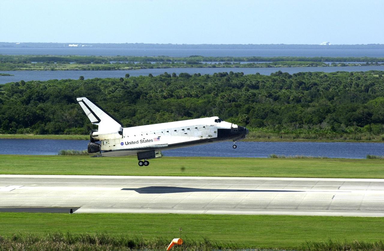 KENNEDY SPACE CENTER, FLA. -- Space Shuttle Atlantis casts a needle-shaped shadow as it drops to the runway at the Shuttle Landing Facility, completing the 4.5-million-mile journey to the International Space Station.  Main gear touchdown occurred at 11:43:40 a.m. EDT; nose gear touchdown at 11:43:48 a.m.; and wheel stop at 11:44:35 a.m.  Mission elapsed time was 10:19:58:44.  Mission STS-112 expanded the size of the Station with the addition of the S1 truss segment.  The returning crew of Atlantis are Commander Jeffrey Ashby, Pilot Pamela Melroy, and Mission Specialists David Wolf, Piers Sellers, Sandra Magnus and Fyodor Yurchikhin. This landing is the 60th at KSC in the history of the Shuttle program.    
