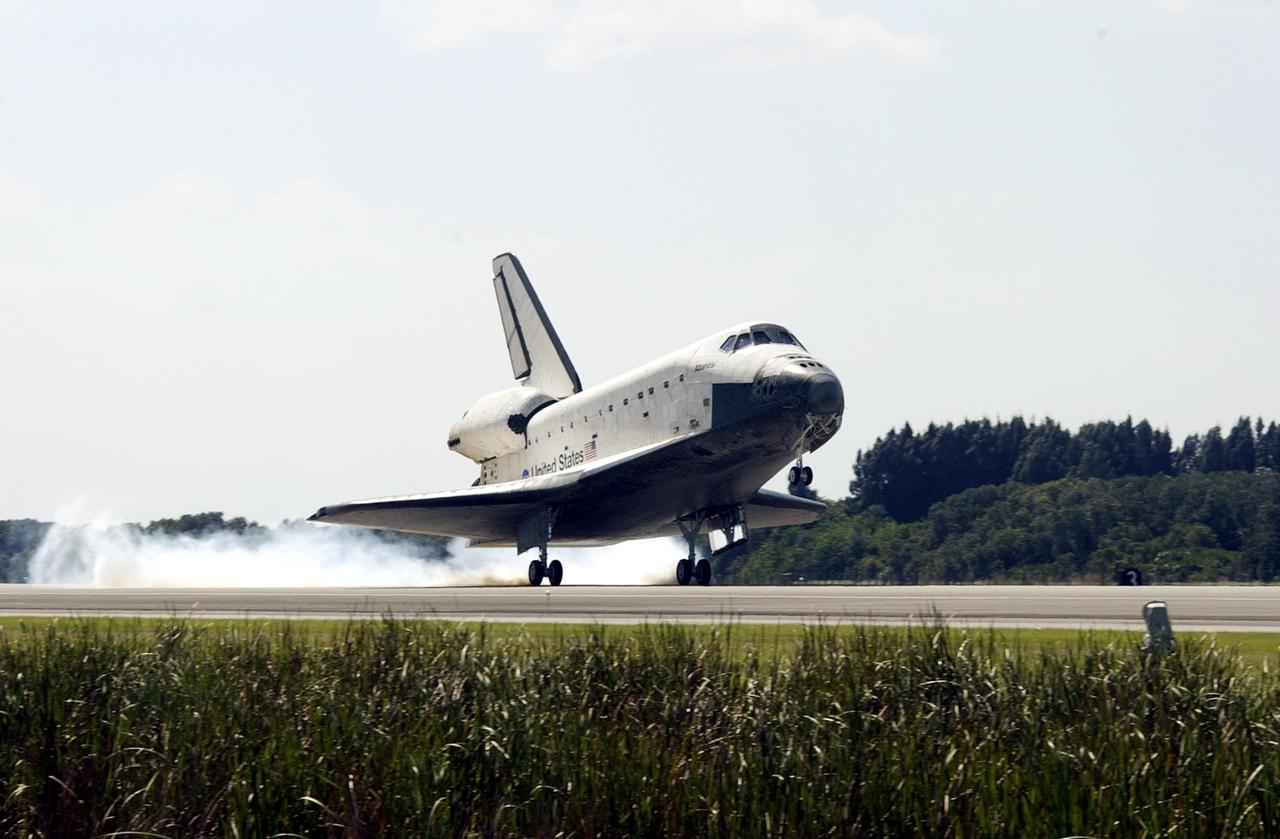 KENNEDY SPACE CENTER, FLA. -- Space Shuttle Atlantis stirs up dust as it touches down on Runway 33 at the Shuttle Landing Facility, completing the 4.5-million-mile journey to the International Space Station.  Main gear touchdown occurred at 11:43:40 a.m. EDT; nose gear touchdown at 11:43:48 a.m.; and wheel stop at 11:44:35 a.m.  Mission elapsed time was 10:19:58:44.  Mission STS-112 expanded the size of the Station with the addition of the S1 truss segment.  The returning crew of Atlantis are Commander Jeffrey Ashby, Pilot Pamela Melroy, and Mission Specialists David Wolf, Piers Sellers, Sandra Magnus and Fyodor Yurchikhin. This landing is the 60th at KSC in the history of the Shuttle program.      .    