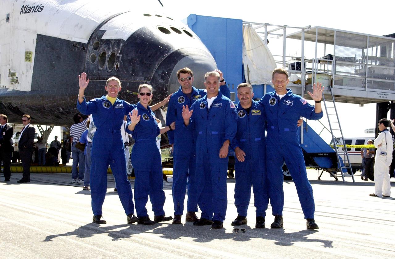 KENNEDY SPACE CENTER, FLA. -- The STS-112 crew clown for the camera in front of Atlantis after saying a few words about their 4.5-million-mile journey to the International Space Station.   From left are Mission Specialist Sandra Magnus, Pilot Pamela Melroy, Commander Jeffrey Ashby, and Mission Specialists David Wolf, Fyodor Yurchikhin and Piers Sellers.  The flawless landing of Space Shuttle Atlantis on Runway 33 at KSC completed the 10 day, 19 hour, 58 minute, 44 second- long mission. Main gear touchdown occurred at 11:43:40 a.m. EDT; nose gear touchdown at 11:43:48 a.m.; and wheel stop at 11:44:35 a.m.  Mission STS-112 expanded the size of the Station with the addition of the S1 truss segment.  