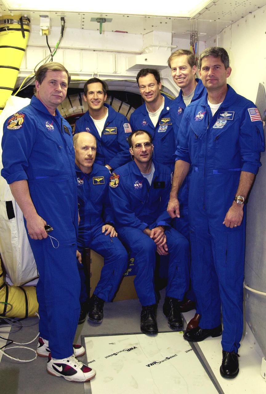 KENNEDY SPACE CENTER, FLA. --  At the entrance to Space Shuttle Endeavour's cockpit, the STS-113 and Expedition 6 crews gather for a photo during Terminal Countdown Demonstration Test activities at the pad.  From left, in front, are cosmonaut Nikolai Budarin, Commander Ken Bowersox and astronaut Donald Pettit of Expedition 6,  and STS-113 Pilot Paul Lockhart.  In back, from left, are STS-113 Mission Specialists John Herrington and Michael Lopez-Alegria and Commander James Wetherbee. The TCDT also includes a simulated launch countdown.  The 16th assembly flight to the International Space Station, STS-113 will carry the Port 1 (P1) truss aboard Space Shuttle Endeavour as well as the Expedition 6 crew, who will replace Expedition 5 on the Station. Mission STS-113 is scheduled to launch Nov. 10, 2002.