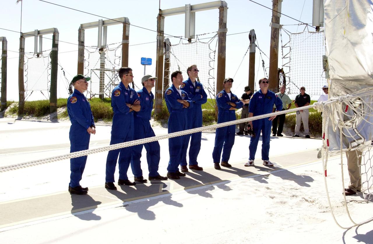 KENNEDY SPACE CENTER, FLA. - As part of Terminal Countdown Demonstration Test (TCDT) activities, the STS-113 and Expedition 6 crews receive training in emergency exit from the orbiter on Launch Pad 39A.  Shown are (from left) Expedition 6 Commander Ken Bowersox; STS-113 Pilot Paul Lockhart; astronaut Donald Pettit; Mission Specialist Michael Lopez-Alegria, Commander James Wetherbee and Mission Specialist John Herrington; and cosmonaut  Nikolai Budarin. The TCDT also includes a simulated launch countdown.  The 16th assembly flight to the International Space Station, STS-113 will carry the Port 1 (P1) truss aboard Space Shuttle Endeavour as well as the Expedition 6 crew, who will replace Expedition 5 on the Station. Mission STS-113 is scheduled to launch Nov. 10, 2002.  