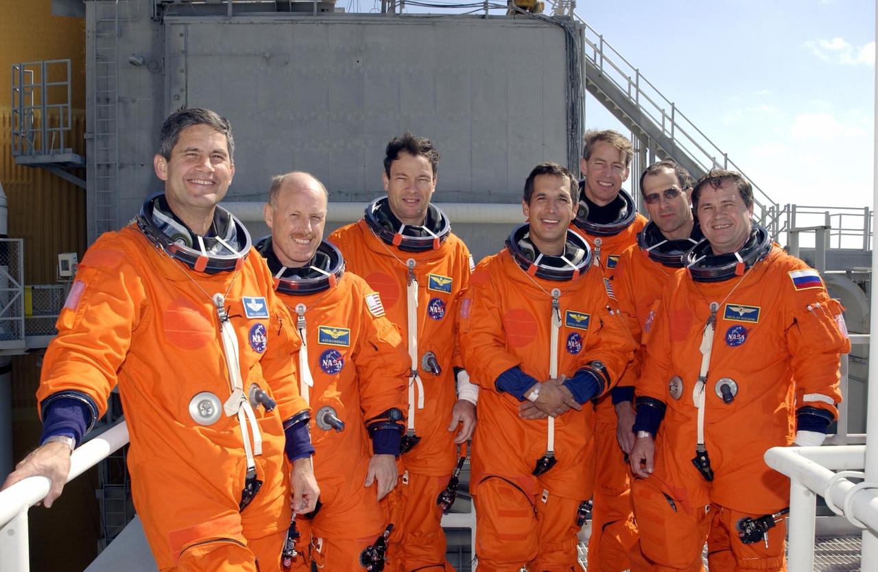 KENNEDY SPACE CENTER, FLA. --  The crews of Mission STS-113 gather for a group photograph on the 195-foot level of the Fixed Service Structure on Launch Pad 39A.  From left are STS-113 Pilot Paul Lockhart; Expedition 6 Commander Ken Bowersox;  STS-113 Mission Specialists Michael Lopez-Alegria and John Herrington, and Commander James Wetherbee; Expedition 6 astronaut Donald Pettit and cosmonaut Nikolai Budarin.  They have been participating in emergency egress training, part of Terminal Countdown Demonstration Test activities in preparation for their launch.  The 16th assembly flight to the International Space Station, STS-113 will carry the Port 1 (P1) truss aboard Space Shuttle Endeavour, as well as Expedition 6, who will replace Expedition 5 on the Station. The mission is scheduled to launch Nov. 10, 2002.        