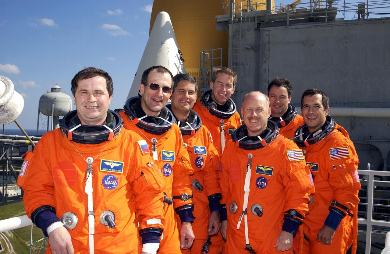 KENNEDY SPACE CENTER, FLA. --   The crews of Mission STS-113 gather for a group photograph on the 195-foot level of the Fixed Service Structure on Launch Pad 39A.  From left are Expedition 6 cosmonaut Nikolai Budarin and astronaut Donald Pettit; STS-113 Pilot Paul Lockhart and Commander James Wetherbee; Expedition 6 Commander Ken Bowersox; STS-113 Mission Specialists Michael Lopez-Alegria and John Herrington. They have been participating in emergency egress training, part of Terminal Countdown Demonstration Test activities in preparation for their launch.  The 16th assembly flight to the International Space Station, STS-113 will carry the Port 1 (P1) truss aboard Space Shuttle Endeavour, as well as Expedition 6, who will replace Expedition 5 on the Station. The mission is scheduled to launch Nov. 10, 2002.       