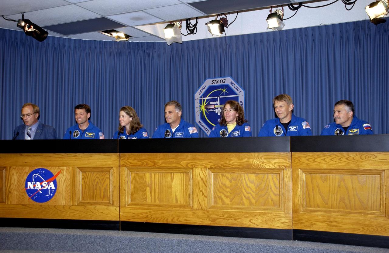 KENNEDY SPACE CENTER, FLA. --  The STS-112 crew takes part in a post-landing briefing for the media.  Moderating, at left, is George Diller, with the NASA News Center.  The crew, from left, are Commander Jeffrey Ashby, Pilot Pamela Melroy and Mission Specialists David Wolf, Sandra Magnus, Piers Sellers and cosmonaut Fyodor Yurchikhin. Mission STS-112  was the 15th assembly flight to the International Space Station, installing the S1 truss.  The landing was the 60th at KSC in the history of the Shuttle program.