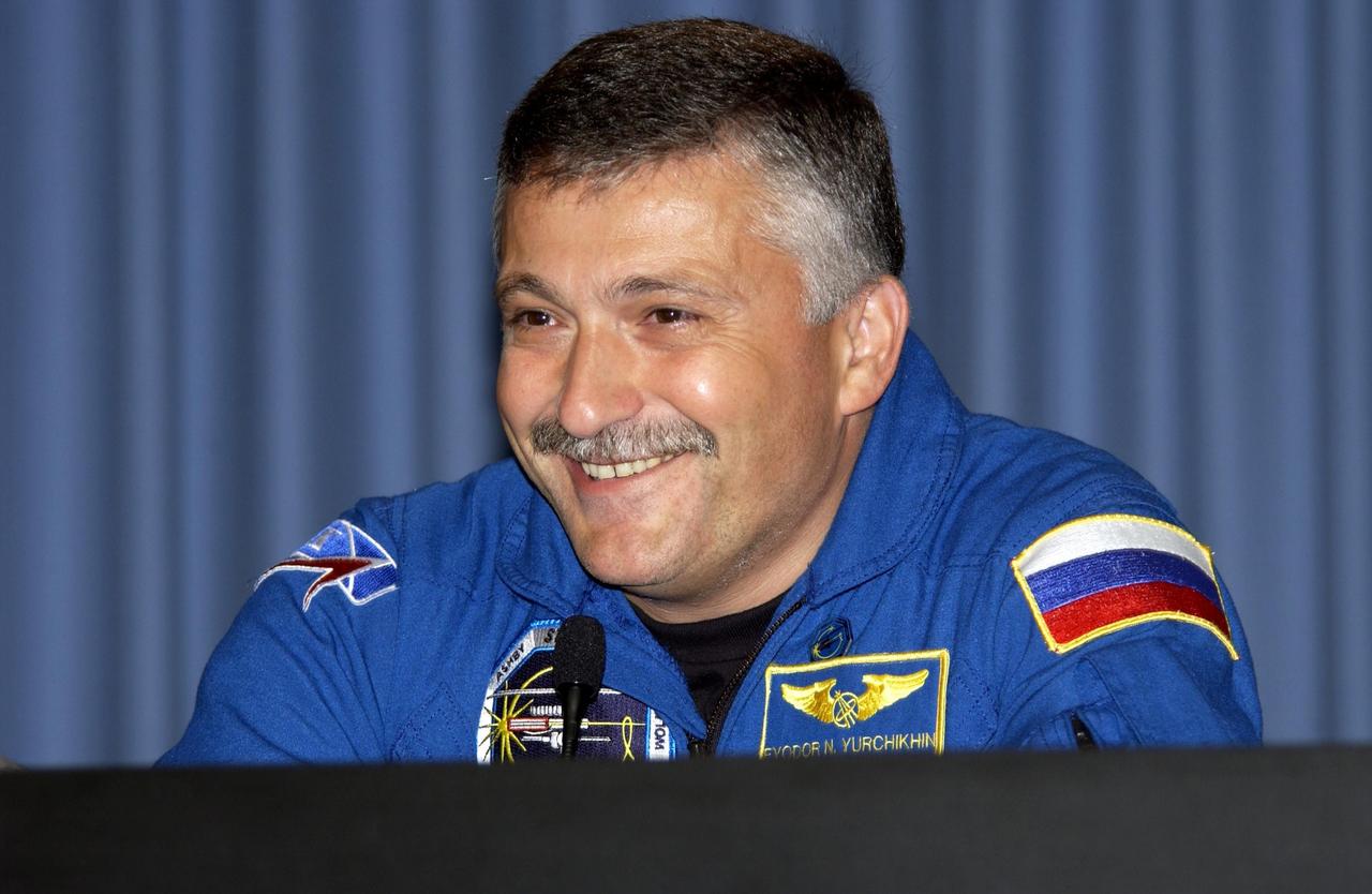 KENNEDY SPACE CENTER, FLA. -- STS-112 Mission Specialist Fyodor Yurchikhin, who represents the Russian Space Agency, smiles at a question posed during the crew's post-landing briefing for the media. Mission STS-112  was the 15th assembly flight to the International Space Station, installing the S1 truss.  The landing was the 60th at KSC in the history of the Shuttle program.