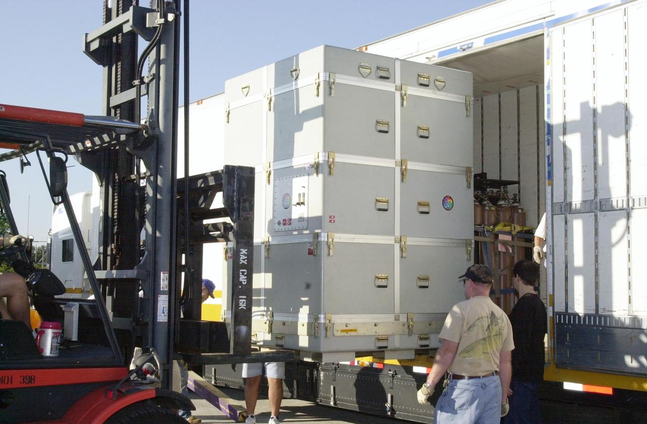 KENNEDY SPACE CENTER, FLA. -- A container with the Solar Radiation and Climate Experiment (SORCE) spacecraft inside is offloaded at the Multi-Purpose Processing Facility at KSC. The spacecraft will undergo final processing for launch. SORCE is equipped with four instruments that will measure variations in solar radiation much more accurately than anything now in use and observe some of the spectral properties of solar radiation for the first time. With data from NASA's SORCE mission, researchers should be able to follow how the Sun affects our climate now and in the future. The SORCE project is managed by NASA's Goddard Space Flight Center. The instruments on the SORCE spacecraft are built by the Laboratory for Atmospheric and Space Physics (LASP). Launch of SORCE aboard a Pegasus XL rocket is scheduled for mid-December 2002. Launch site is Cape Canaveral Air Force Station, Fla.