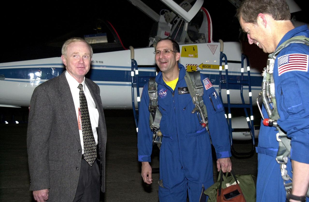 KENNEDY SPACE CENTER, FLA. -  Center Director Roy Bridges (left) welcomes the arrival of two crew members on mission STS-113.  At right is Mission Commander James Wetherbee; in the center is Expedition 6 Flight Engineer Donald Pettit.  They and other crew members are arriving at KSC to prepare for launch, scheduled for Nov. 11 between midnight and 4 a.m. EST. The primary mission is bringing the Expedition 6 crew to the Station and returning the Expedition 5 crew to Earth.  The major objective of the mission is delivery of the Port 1 (P1) Integrated Truss Assembly, which will be attached to the port side of the S0 truss.  Three spacewalks are planned to install and activate the truss and its associated equipment.   