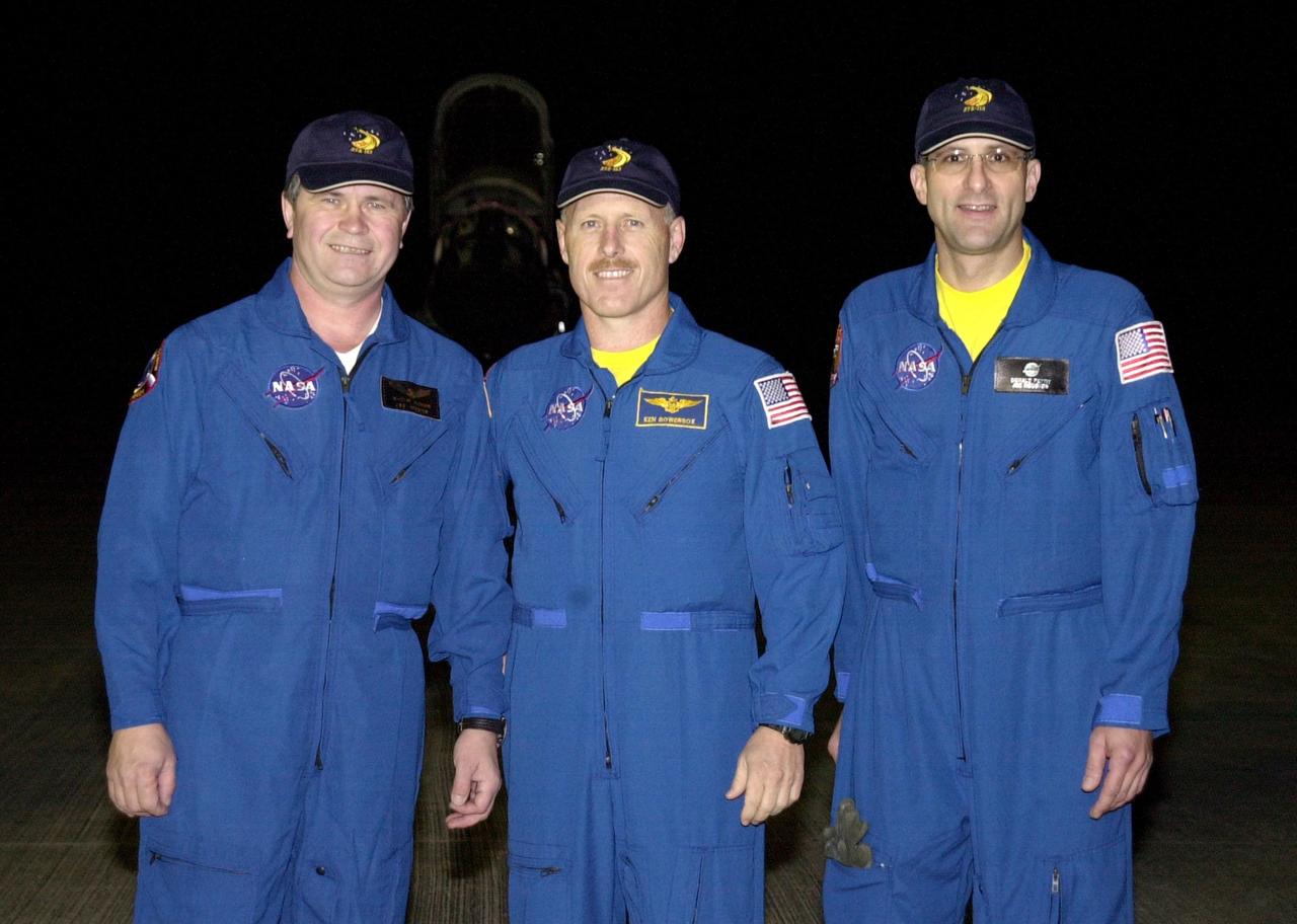 KENNEDY SPACE CENTER, FLA. --  The Expedition 6 crew poses for a photo after their arrival at the KSC Shuttle Landing Facility to prepare for launch on mission STS-113.  From left are Flight Engineer Nikolai Budarin, Commander Ken Bowersox and Flight Engineer Donald Pettit. The primary mission of STS-113 is bringing the Expedition 6 crew to the Station and returning the Expedition 5 crew to Earth.  In addition, the major objective of the mission is delivery of the Port 1 (P1) Integrated Truss Assembly, which will be attached to the port side of the S0 truss.  Three spacewalks are planned to install and activate the truss and its associated equipment.  Launch of Space Shuttle Endeavour on mission STS-113 is scheduled for Nov. 11 between midnight and 4 a.m. EST.