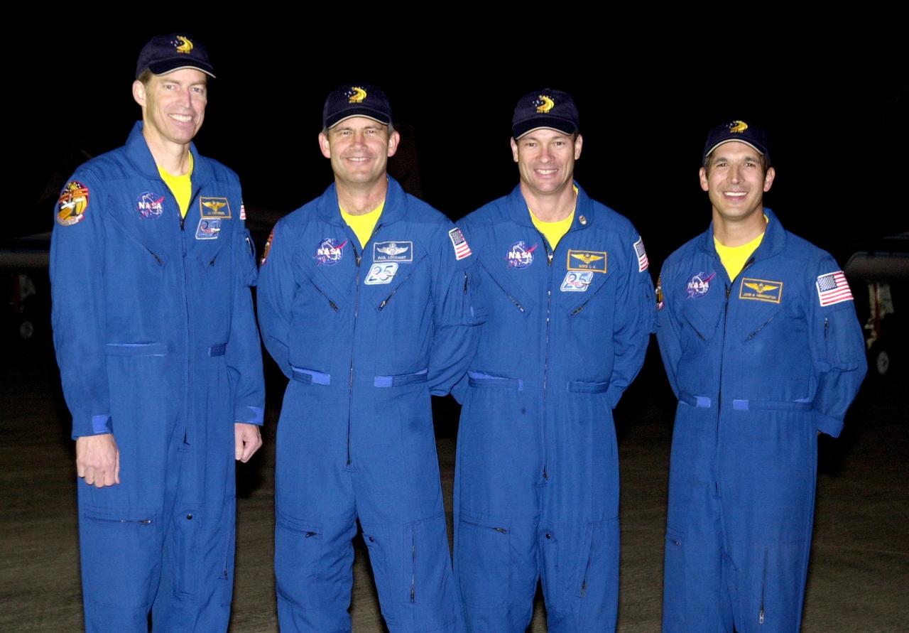KENNEDY SPACE CENTER, FLA. - The STS-113 crew poses for a photo after their arrival at the KSC Shuttle Landing Facility to prepare for launch.  From left are Commander James Wetherbee, Pilot Paul Lockhart, and Mission Specialists Michael Lopez-Alegria and John Herrington. The primary mission of STS-113 is bringing the Expedition 6 crew to the Station and returning the Expedition 5 crew to Earth.  In addition, the major objective of the mission is delivery of the Port 1 (P1) Integrated Truss Assembly, which will be attached to the port side of the S0 truss.  Three spacewalks are planned to install and activate the truss and its associated equipment.  Launch of Space Shuttle Endeavour on mission STS-113 is scheduled for Nov. 11 between midnight and 4 a.m. EST.
