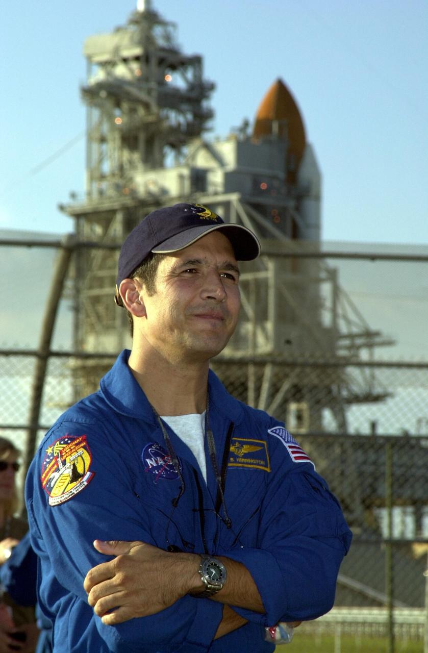 KENNEDY SPACE CENTER, FLA. - STS-113 Mission Specialist John Herrington pauses in front of Space Shuttle Endeavour at Launch Pad 39A during a tour of Kennedy Space Center prior to his launch.  Upon launch, Herrington will become the first Native American in space.  The primary mission of STS-113 is bringing the Expedition 6 crew to the Station and returning the Expedition 5 crew to Earth.  Another major objective of the mission is delivery of the Port 1 (P1) Integrated Truss Assembly, which will be attached to the port side of the S0 truss.  Three spacewalks are planned to install and activate the truss and its associated equipment.  Launch of Space Shuttle Endeavour on mission STS-113 is scheduled for Nov. 11 between midnight and 4 a.m. EST.