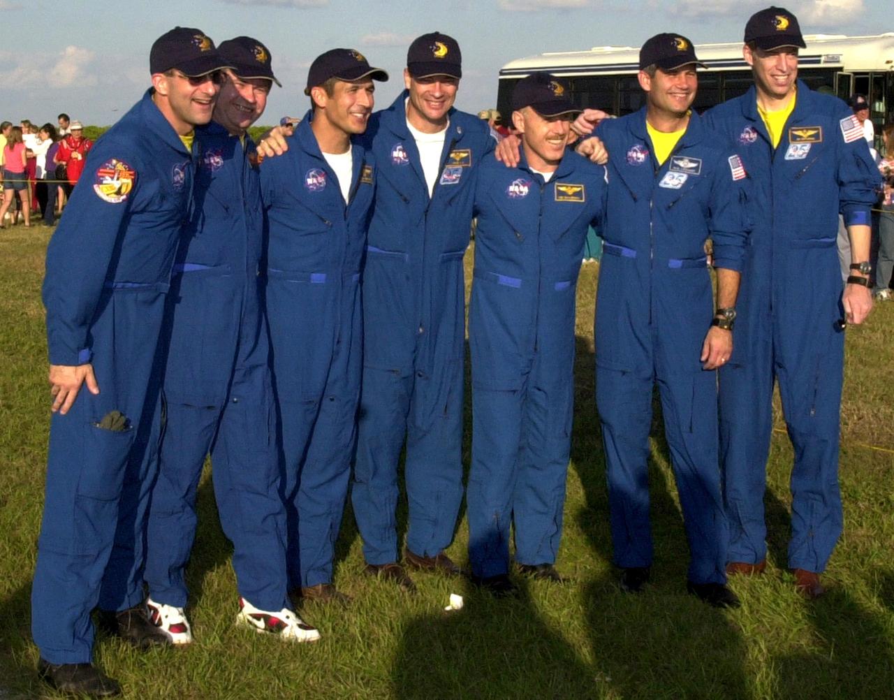 KENNEDY SPACE CENTER, FLA. - The STS-113 and Expedition Six crews pose for a group photo at Launch Pad 39A with Space Shuttle Endeavour in the background during a tour of Kennedy Space Center prior to their launch.  From left are Expedition Six crew members Donald Pettit and Nikolai Budarin of the Russian Space Agency, STS-113 Mission Specialists John Herrington and Michael Lopez-Alegria, Expedition Six Commander Ken Bowersox, STS-113 Pilot Paul Lockhart, and STS-113 Commander James Wetherbee. The primary mission of STS-113 is bringing the Expedition 6 crew to the Station and returning the Expedition 5 crew to Earth.  Another major objective of the mission is delivery of the Port 1 (P1) Integrated Truss Assembly, which will be attached to the port side of the S0 truss.  Three spacewalks are planned to install and activate the truss and its associated equipment.  Launch of Space Shuttle Endeavour on mission STS-113 is scheduled for Nov. 11 between midnight and 4 a.m. EST.