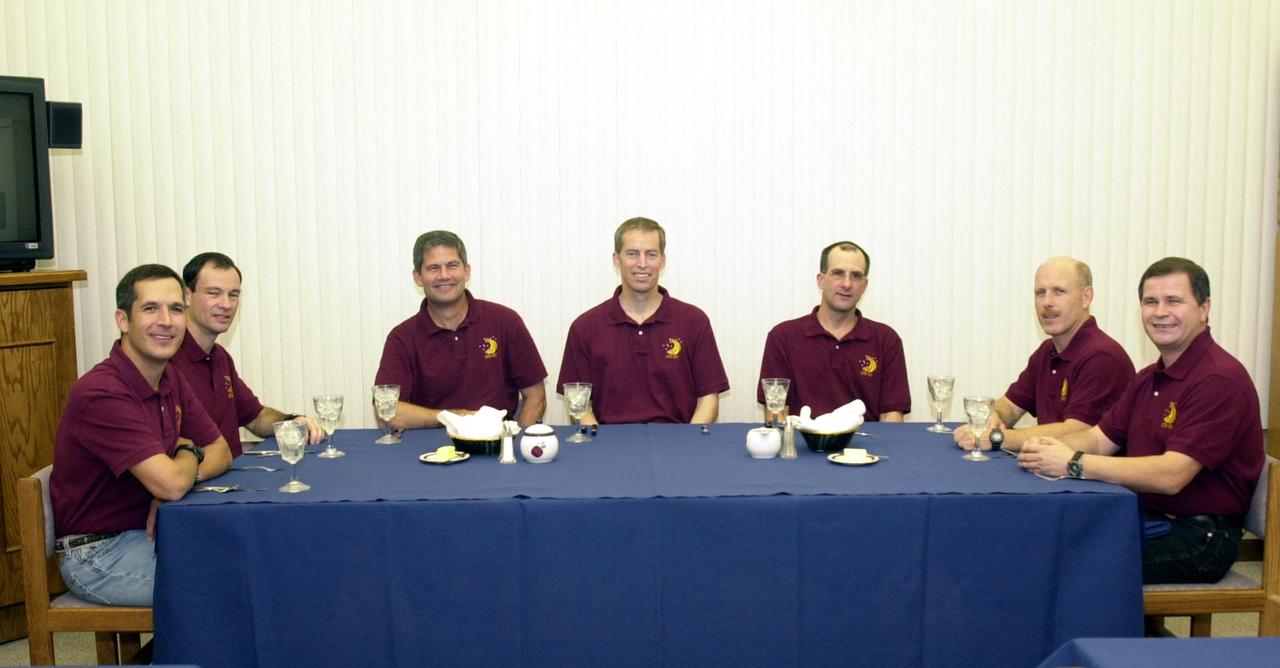 KENNEDY SPACE CENTER, FLA. --  The STS-113 crew enjoys a snack before suiting up for launch.  Seated left to right are Mission Specialists John Herrington and Michael Lopez-Alegria, Pilot Paul Lockhart and Commander James Wetherbee; Expedition 6 flight engineer Donald Pettit, Commander Ken Bowersox and flight engineer Nikolai Budarin. STS-113 is the 16th American assembly flight to the International Space Station.  The primary mission is bringing the Expedition 6 crew to the Station and returning the Expedition 5 crew to Earth.  The major objective of the mission is delivery of the Port 1 (P1) Integrated Truss Assembly, which will be attached to the port side of the S0 truss.  Three spacewalks are planned to install and activate the truss and its associated equipment.  Launch of Space Shuttle Endeavour on mission STS-113 is scheduled for Nov. 11 at 12:58 a.m. EST.   