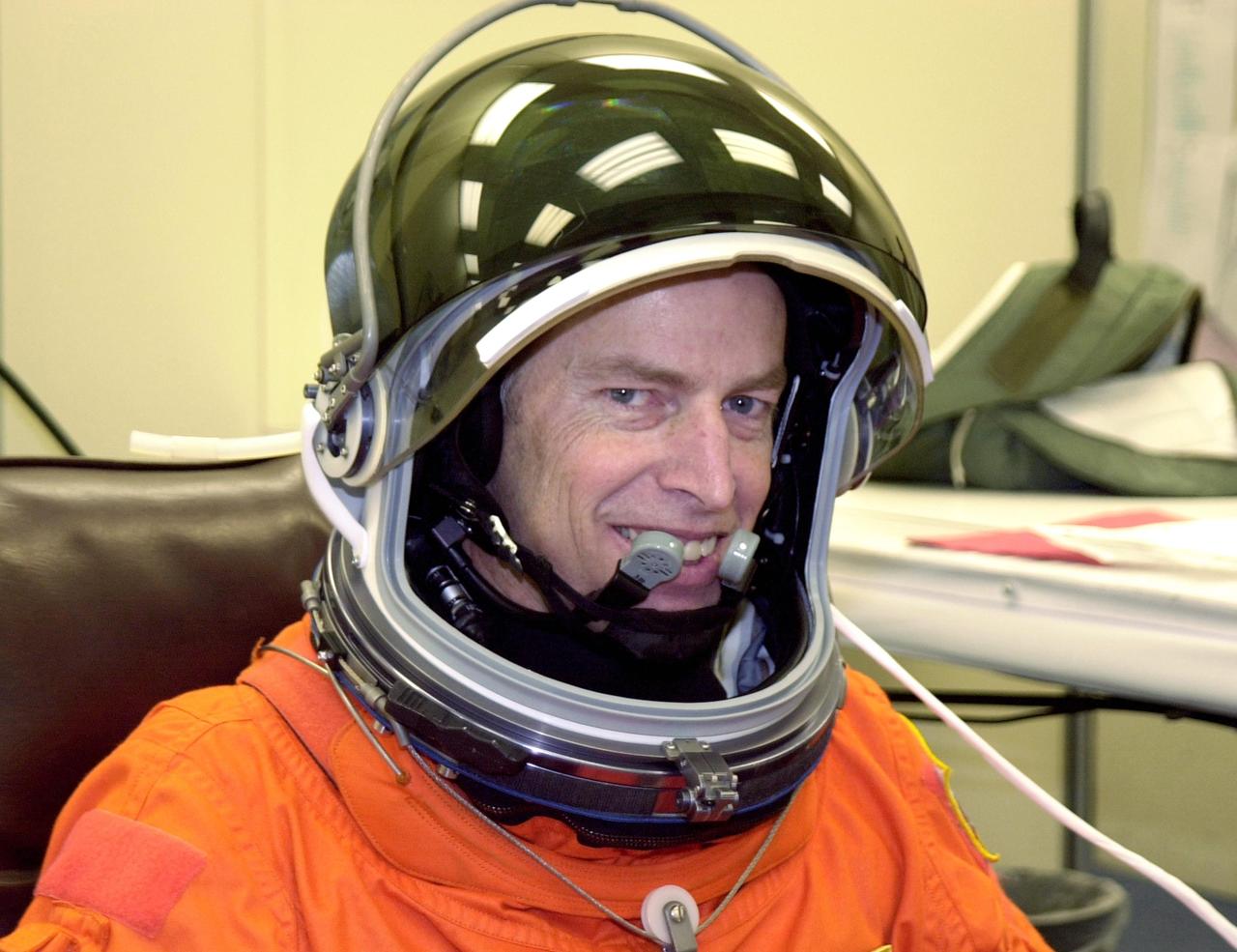 KENNEDY SPACE CENTER, FLA. - STS-113 Commander James Wetherbee is happy to suit up before launch.  Wetherbee will be making his sixth Shuttle flight. The primary mission is bringing the Expedition 6 crew to the Station and returning the Expedition 5 crew to Earth.  The major objective of the mission is delivery of the Port 1 (P1) Integrated Truss Assembly, which will be attached to the port side of the S0 truss.  Three spacewalks are planned to install and activate the truss and its associated equipment.  Launch of Space Shuttle Endeavour on mission STS-113 is scheduled for Nov. 11 at 12:58 a.m. EST.