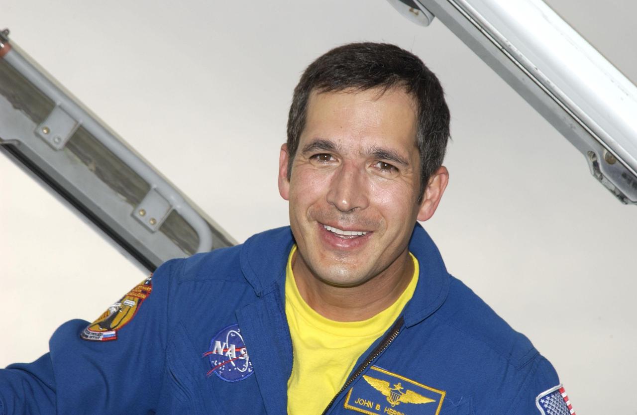 KENNEDY SPACE CENTER, FLA. -- STS-113 Mission Specialist John B. Herrington smiles for the camera upon his arrival at KSC's Shuttle Landing Facility to prepare for launch. STS-113 is the 16th American assembly flight to the International Space Station. The primary objective of the mission is bringing the Expedition 6 crew to the Station and returning the Expedition 5 crew to Earth. The major task of the mission is delivery of the Port 1 (P1) Integrated Truss Assembly, which will be attached to the port side of the S0 truss. Three spacewalks are planned to install and activate the truss and its associated equipment. Launch of Space Shuttle Endeavour on mission STS-113 is targeted for no earlier than Nov. 22 between 7 and 11 p.m. EST.