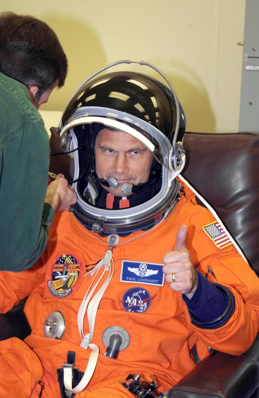 KENNEDY SPACE CENTER, FLA. --  STS-113 Pilot Paul Lockhart shows thumbs up for launch as he finishes suiting up.  Lockhart will be making his second Shuttle flight. The primary mission for the crew is bringing the Expedition 6 crew to the Station and returning the Expedition 5 crew to Earth.  The major objective of the mission is delivery of the Port 1 (P1) Integrated Truss Assembly, which will be attached to the port side of the S0 truss.  Three spacewalks are planned to install and activate the truss and its associated equipment.  Launch of Space Shuttle Endeavour on mission STS-113 is scheduled for 8:15 p.m. EST.    