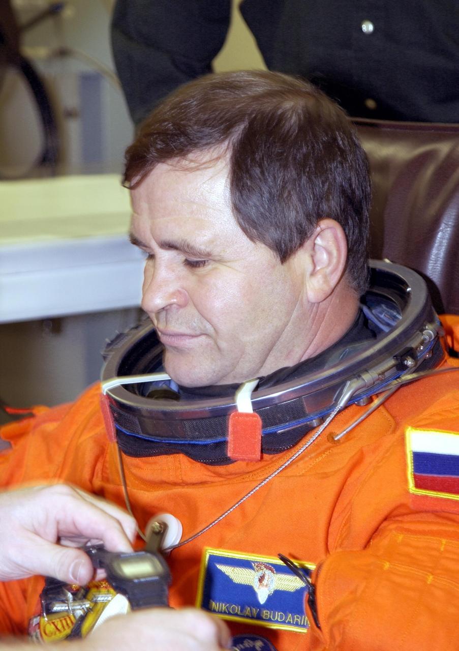 KENNEDY SPACE CENTER, FLA. - Expedition 6 flight engineer Nikolai Budarin relaxes during suitup for launch.   Budarin, who is with the Russian Space Agency,  will be making his second Shuttle flight. The primary mission for the crew is bringing the Expedition 6 crew to the Station and returning the Expedition 5 crew to Earth.  The major objective of the mission is delivery of the Port 1 (P1) Integrated Truss Assembly, which will be attached to the port side of the S0 truss.  Three spacewalks are planned to install and activate the truss and its associated equipment.  Launch of Space Shuttle Endeavour on mission STS-113 is scheduled for 8:15 p.m. EST.    